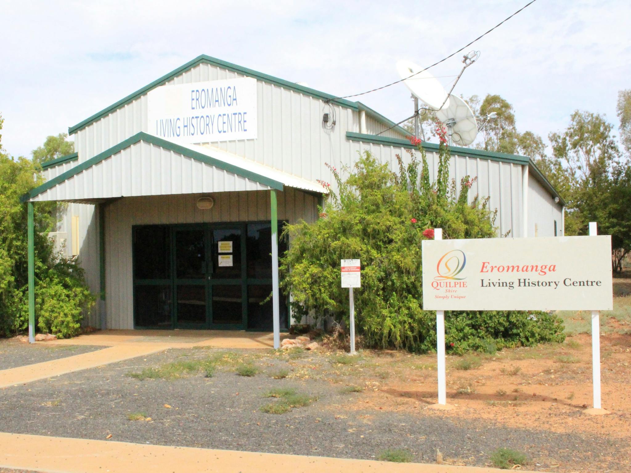 Eromanga Living history centre sign, entrance way, bush either side of the entrace Eromanga Living history centre sign, entrance way, bush either side of the entrace