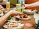 Cocktails and Southern American dishes on a table at The Yard Bright