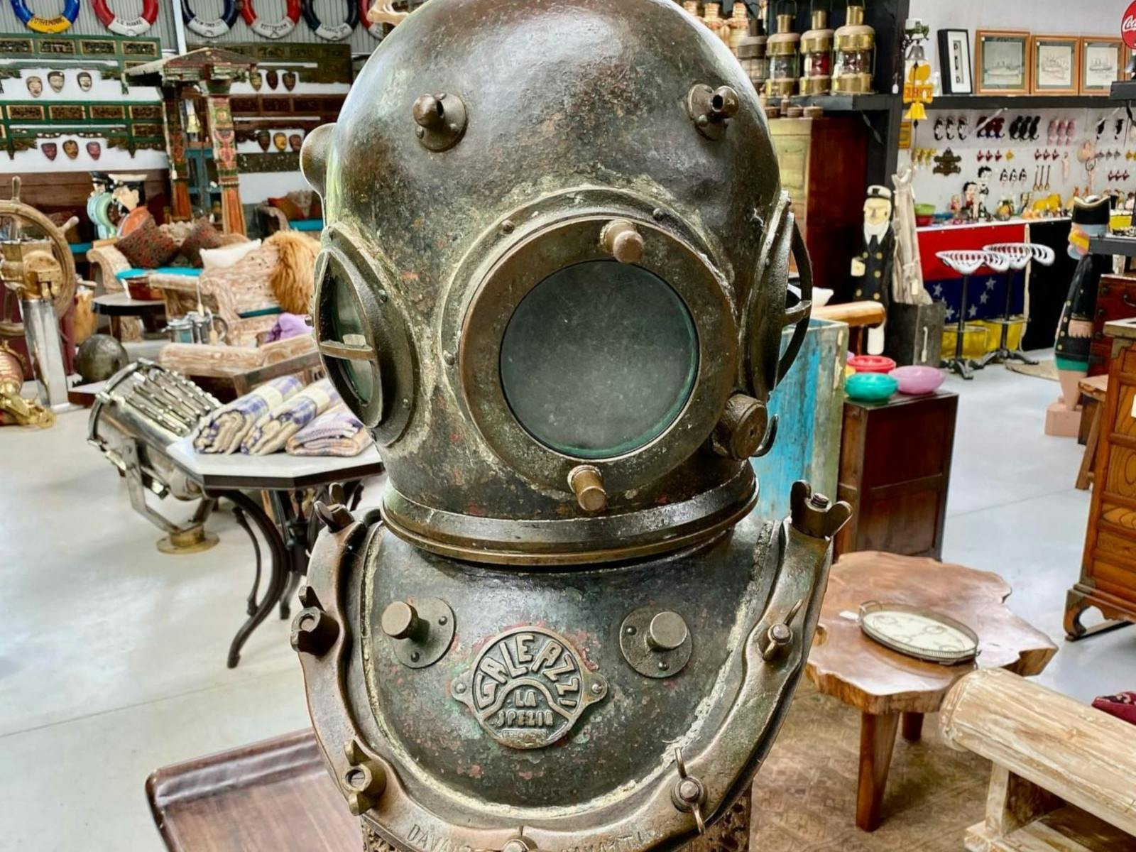 an old diving helmet on display at the antique centre