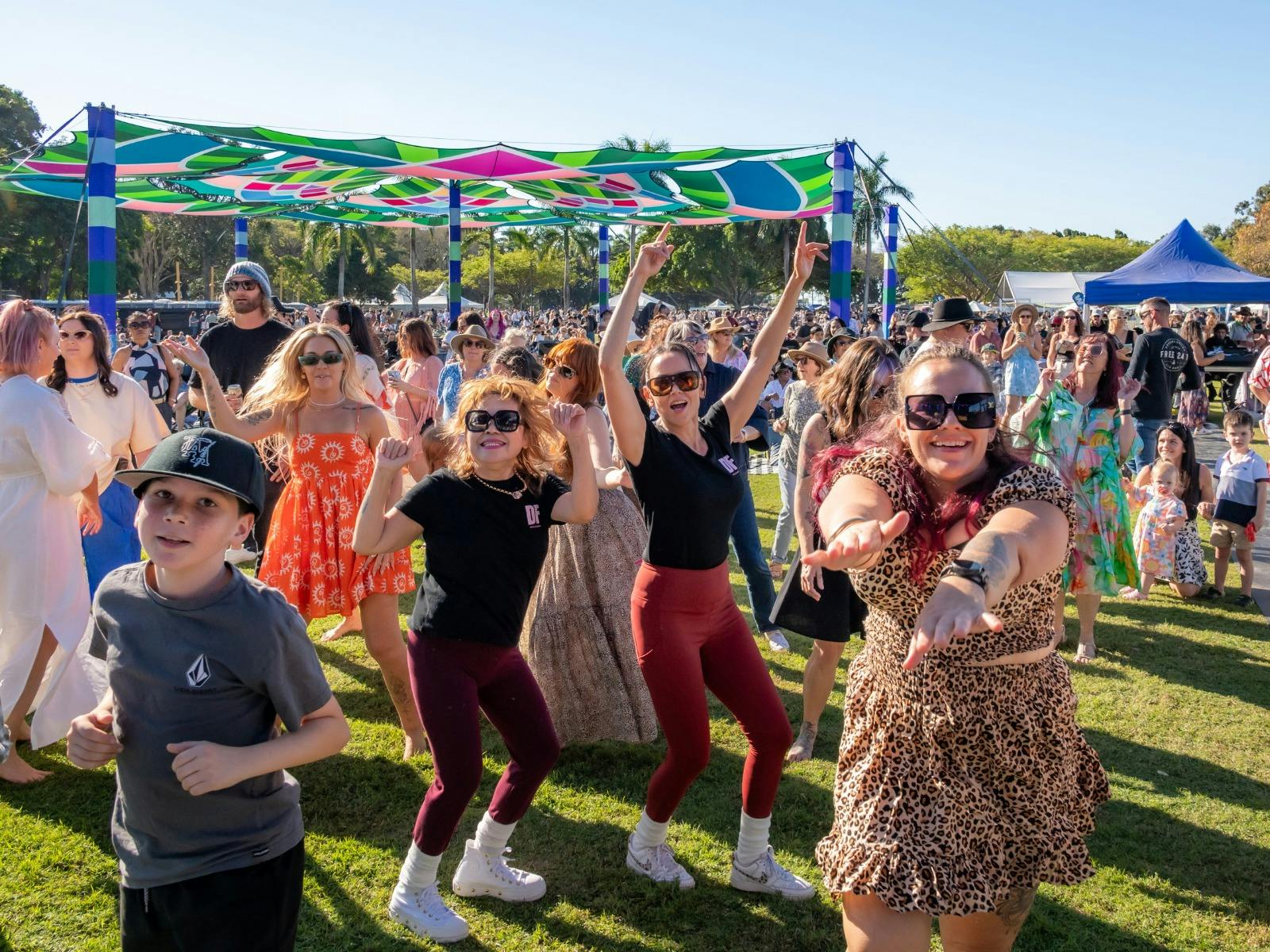 Group of people dancing at a Festival Group of people dancing at a Festival