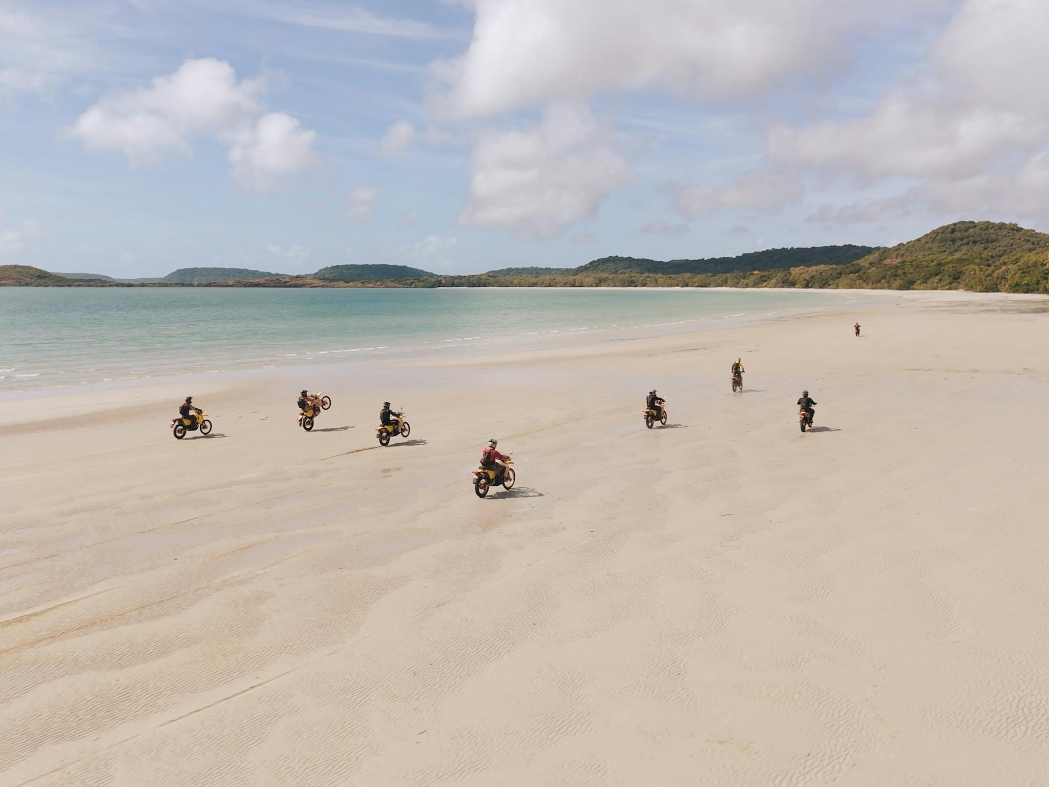 Bikes riding on a beach in Cape York Bikes riding on a beach in Cape York