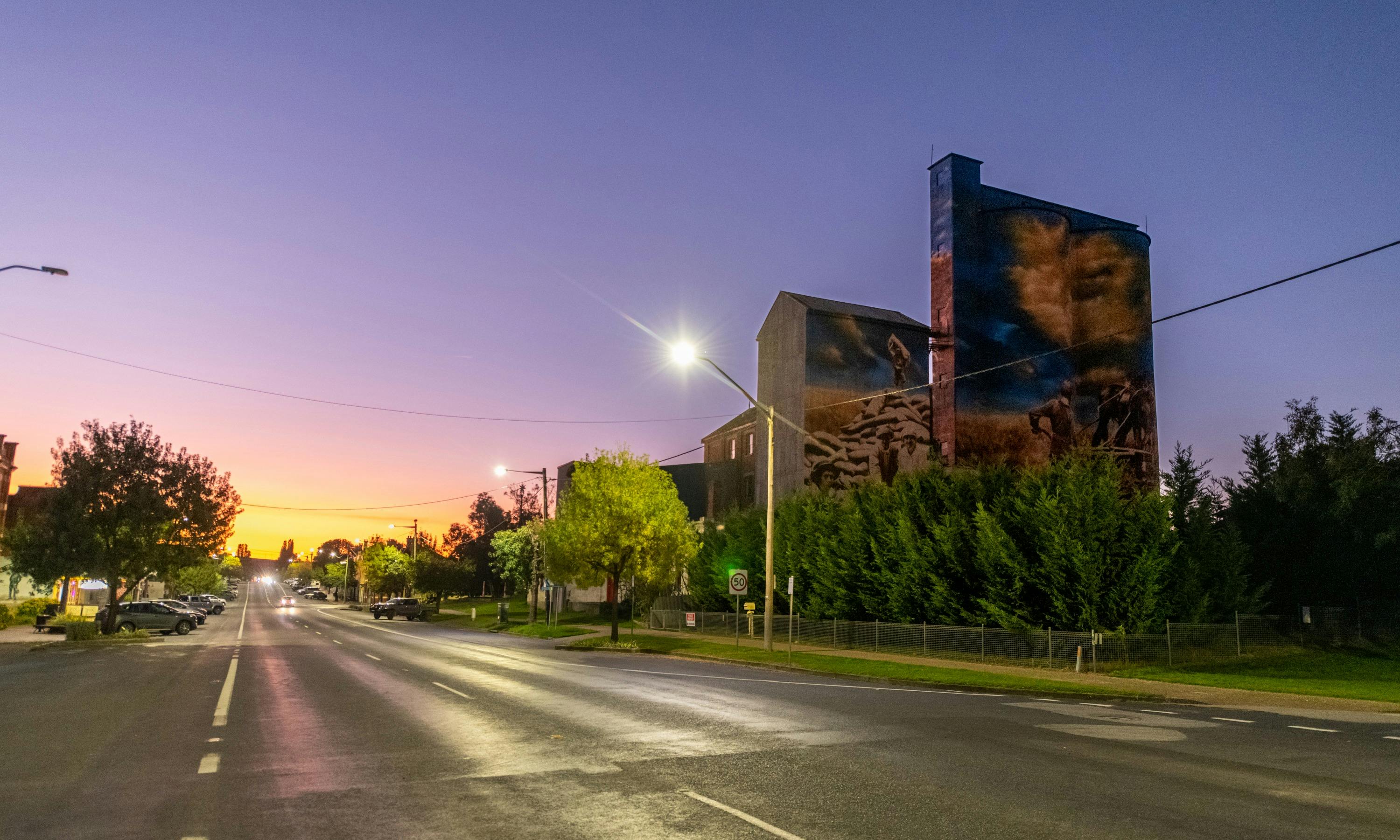 View of Albury Street, Murrumburrah at twilight with silo art in view.