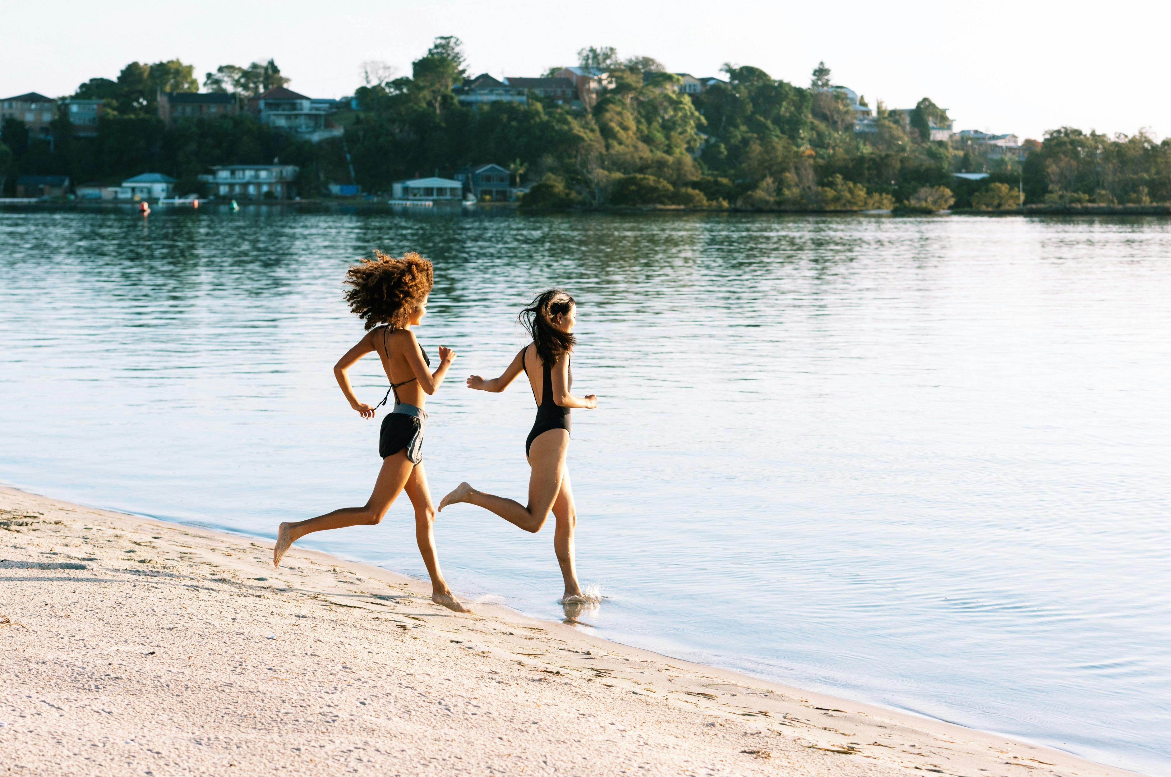 Friends heading for a swim at Naru Beach, Lake Macquarie