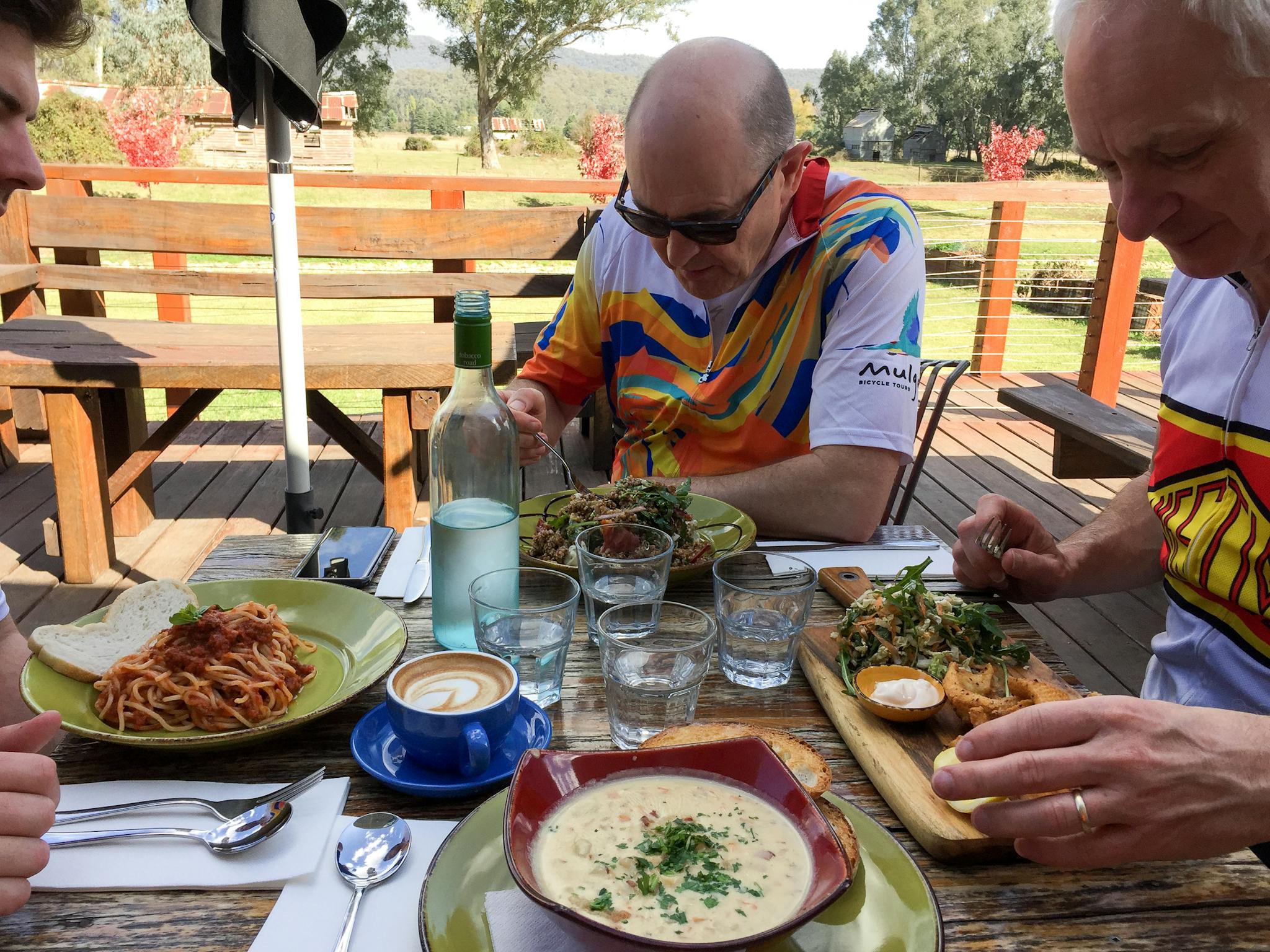 3 guests eat lunch at one of the many cafes visited on tour