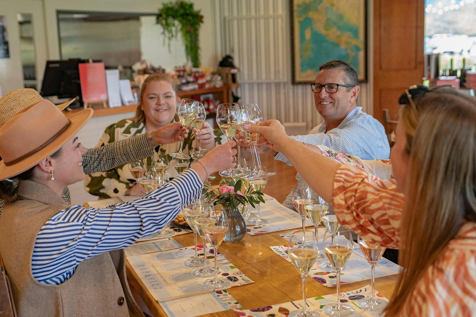 Clinking glasses at Pizzini Sparling Italians high tea experience