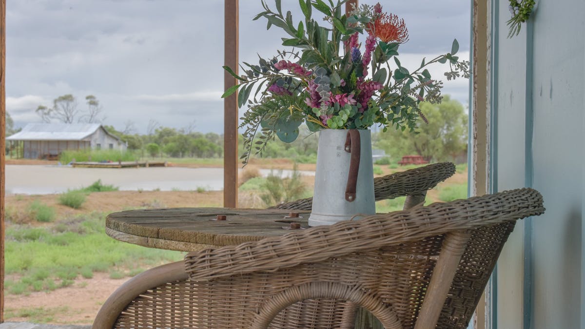 Wellshot cottage front verandah looks out over the baby lake