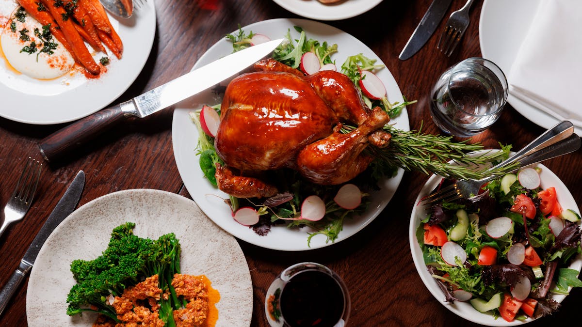 Chiken Sunday Roast on a table with sides, at Lennons Restaurant & Bar, Brisbane City