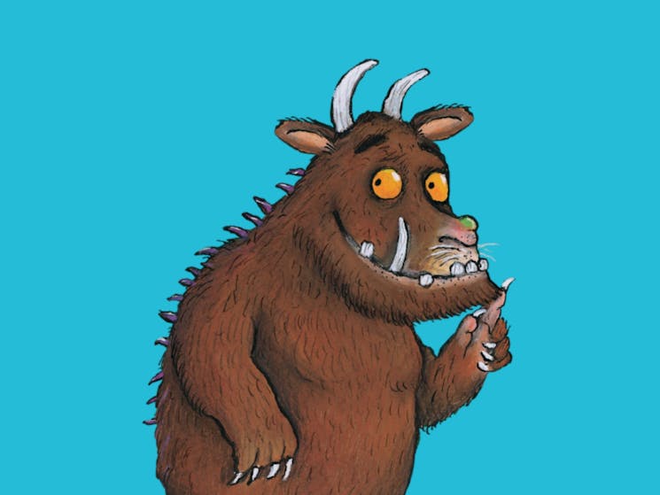 The Gruffalo looking straight ahead on a blue background.