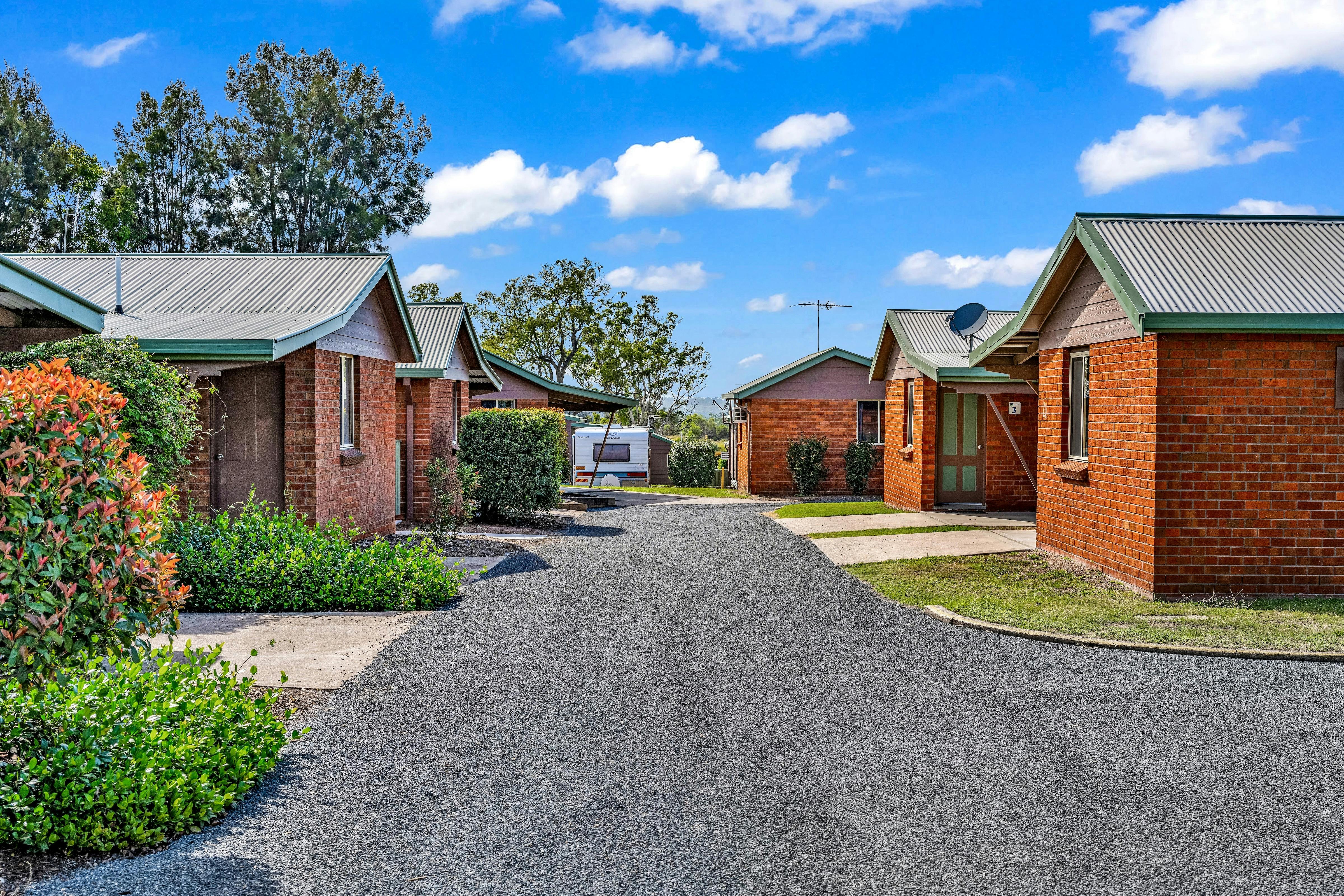 cabins with undercover parking ensuite kitchen bathroom living dining tv air con