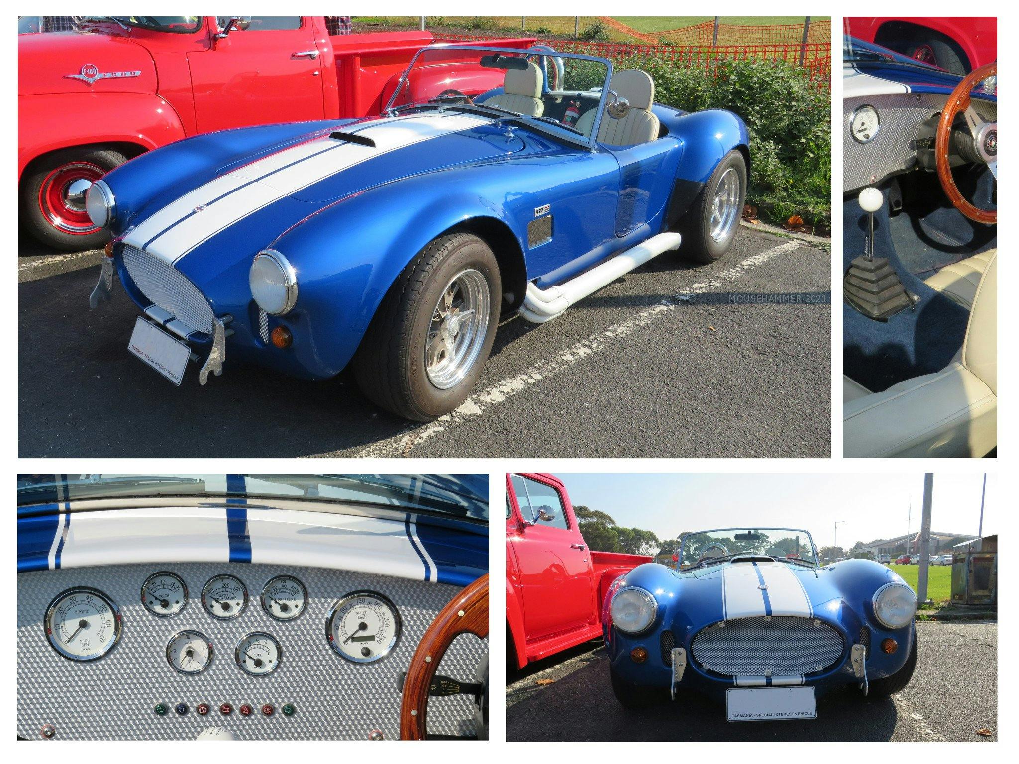 A long slung sports car in metallic blue, white bonnet stripe