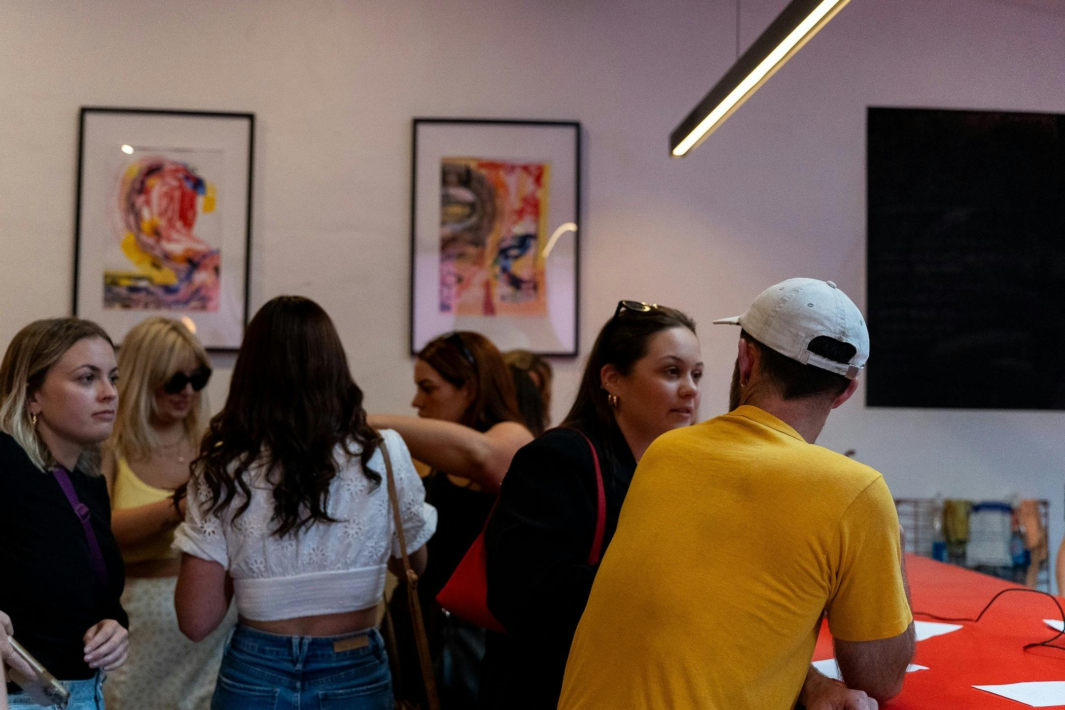 Pam's dining room in an event with crowd standing near bar