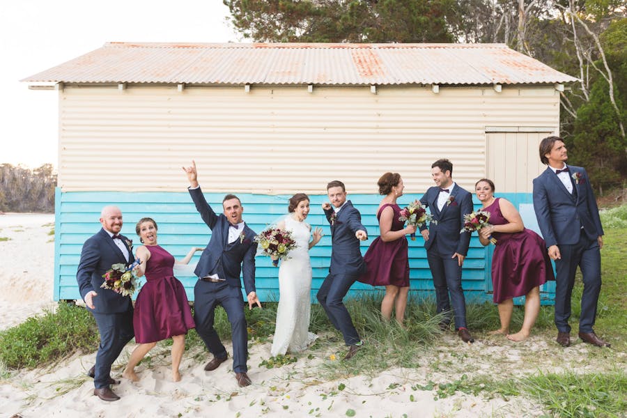 Bridal party in front of boat shed