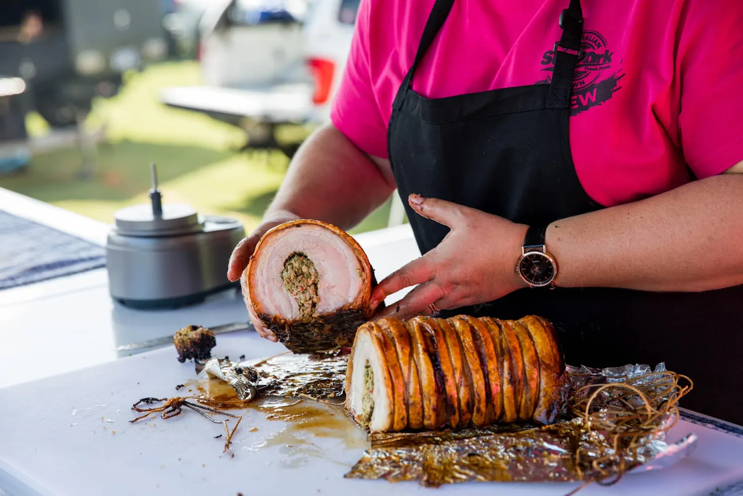 Meat Noosa BBQ Festival – Pitmaster Smoking Brisket – A skilled pitmaster tending to a smoker at Mea