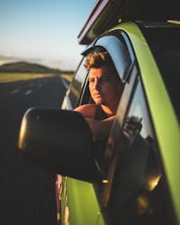 Man looking out of campervan