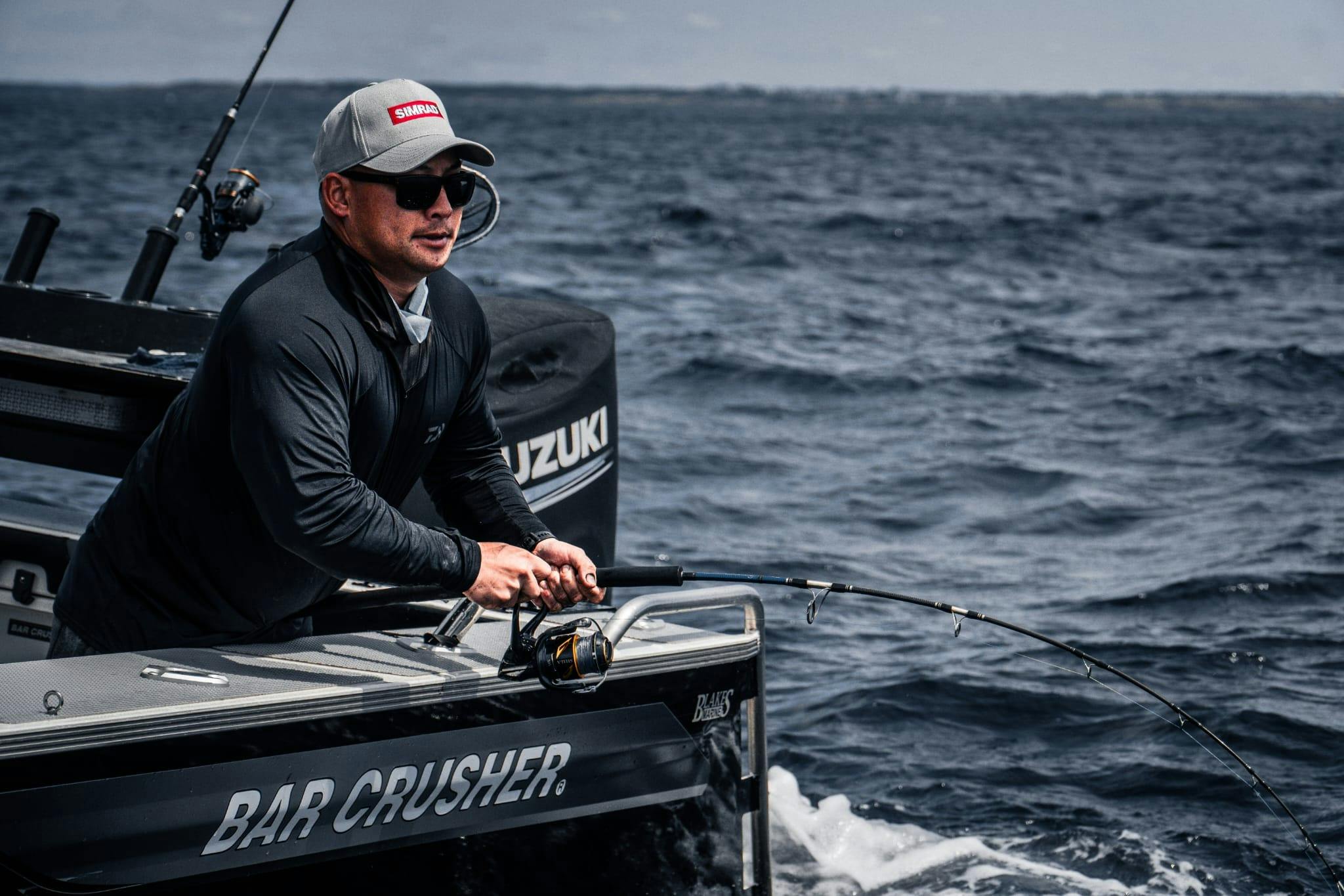 Reel Adventure Fishing - An angler reeling in a monster fish. Sydney Fishing Charter