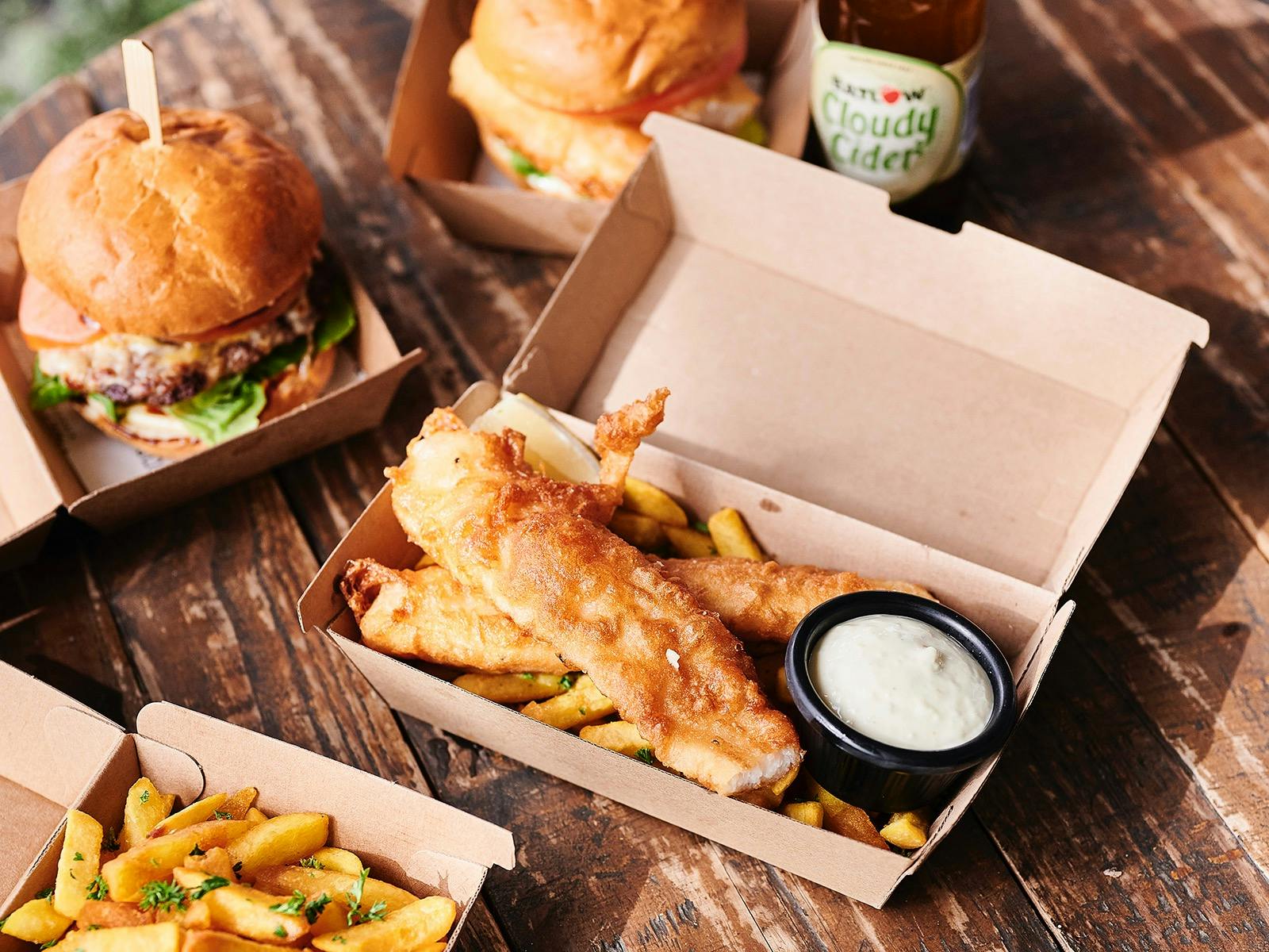 Fish and chips in takeaway containers