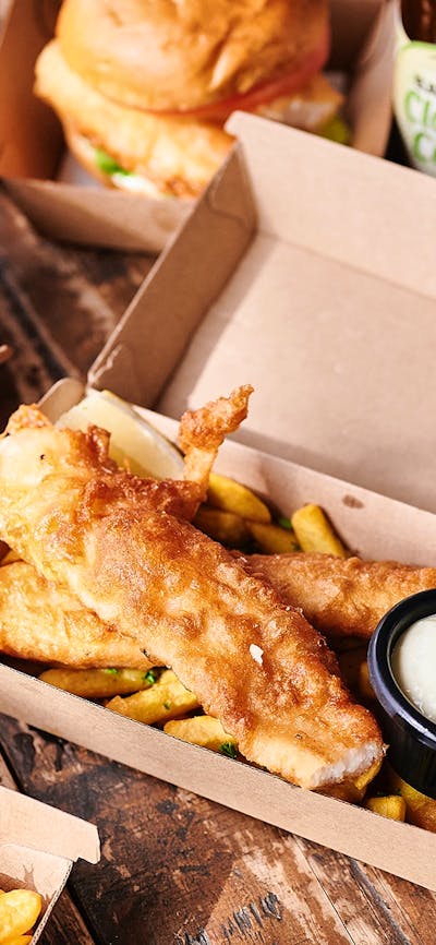 Fish and chips in takeaway containers