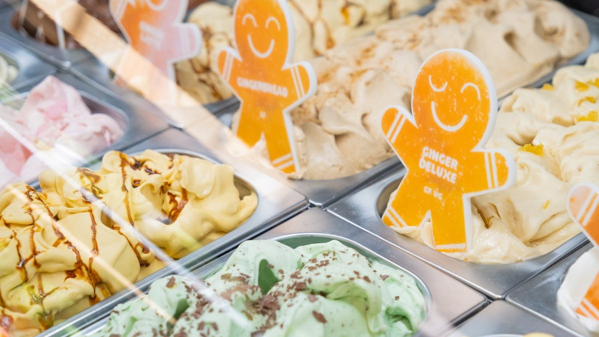 Colourful gelato tubs in freezer with cheeky gingerbread men name labels