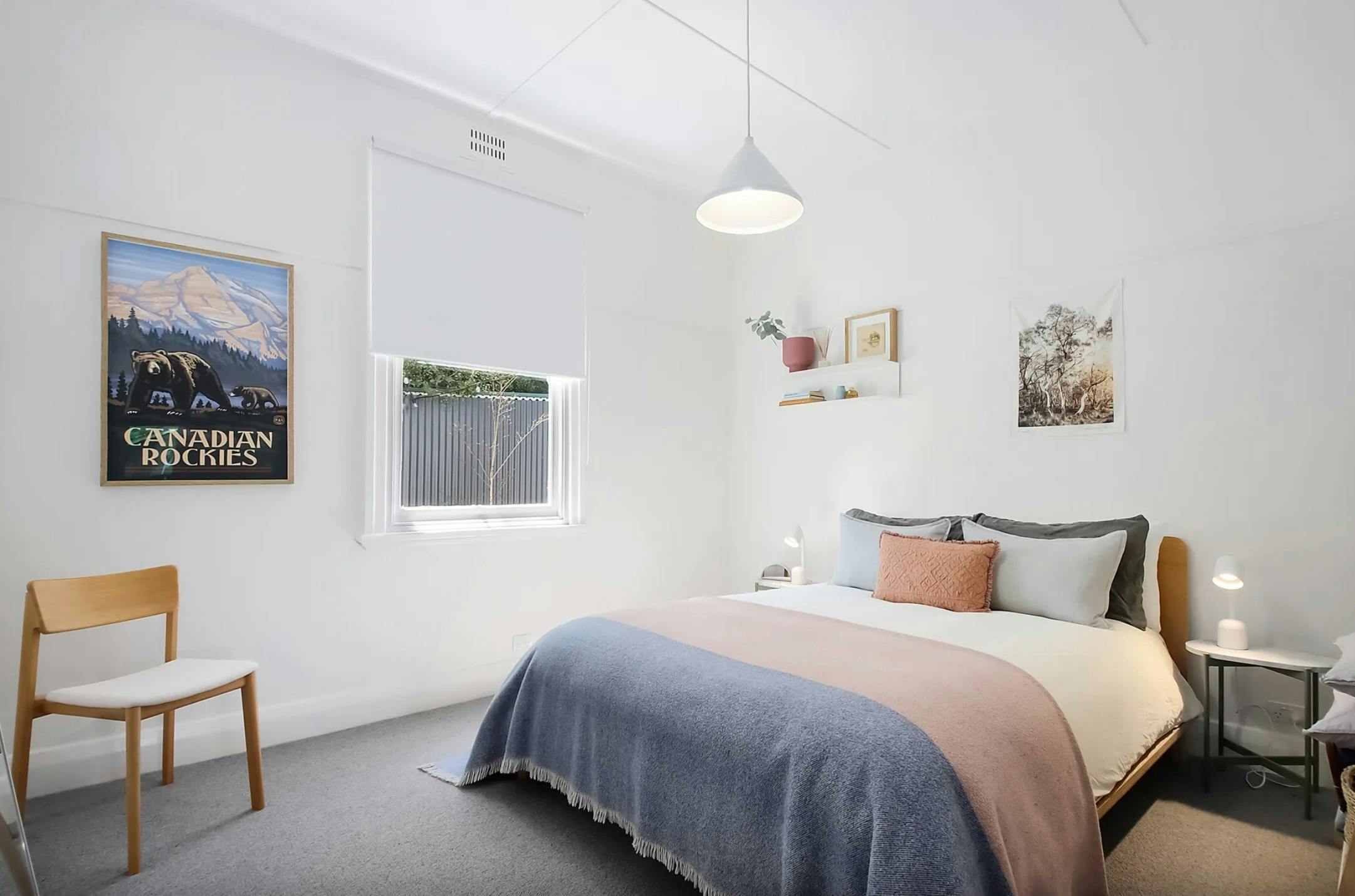 A light and comfortable Queen bedroom with soft furnishings