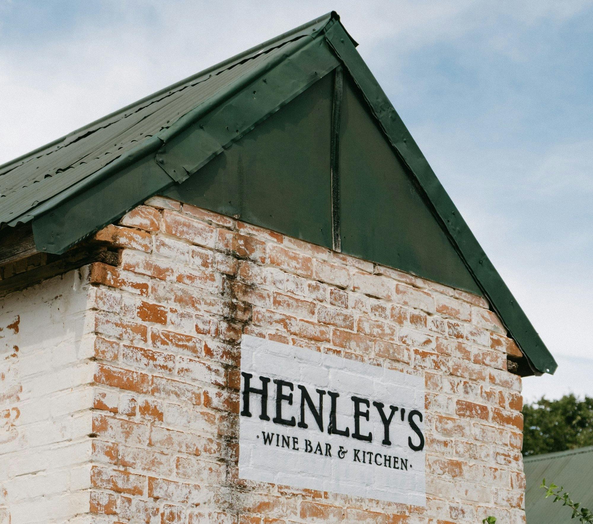 Henley's sign on a brick wall