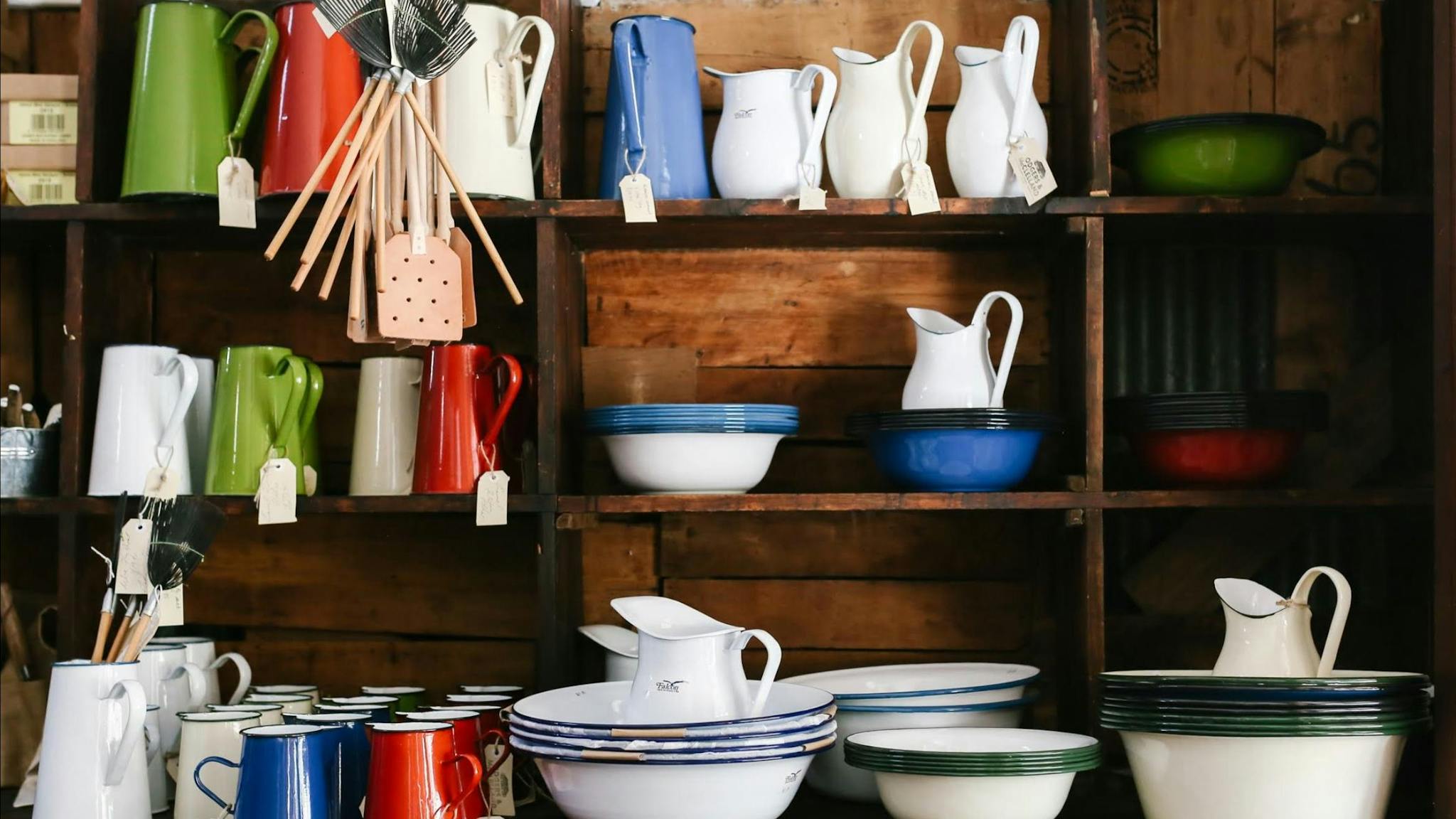 Falcon and Romanian enamelware on the original packing case shelves.