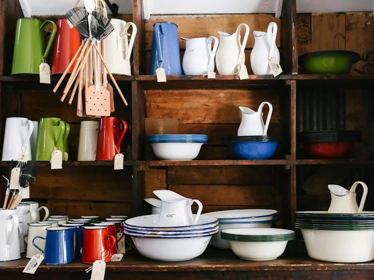 Falcon and Romanian enamelware on the original packing case shelves.