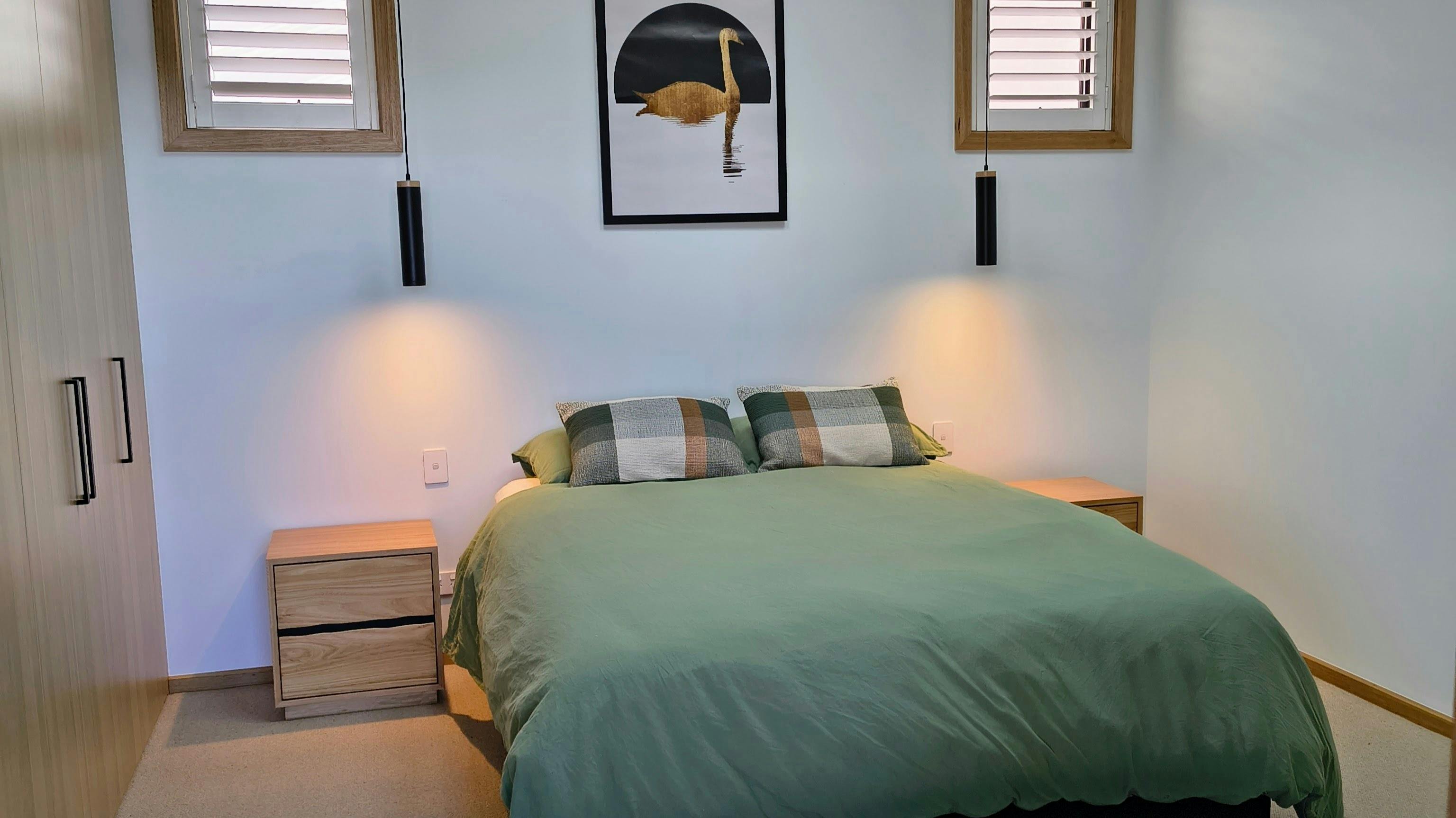 Spacious Queen bed with views through to the Swan River, sky lights for star gazing and powder room