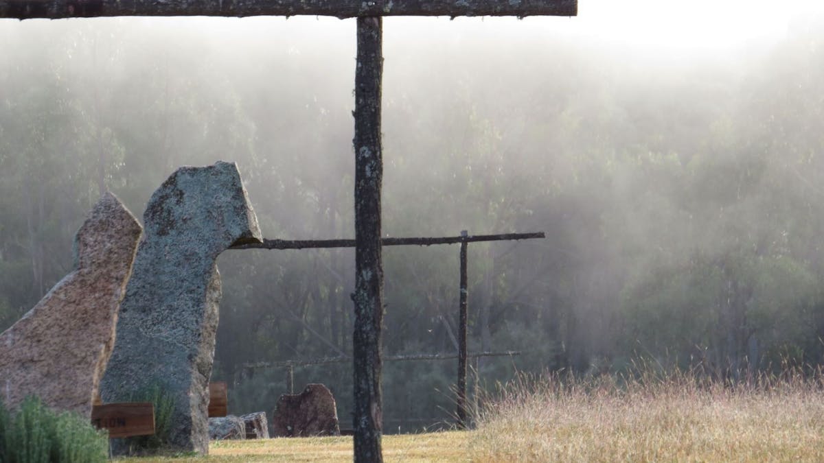 Rising early morning mist through the line of spiritual gateways at the Tree of Life Spiritual Walk