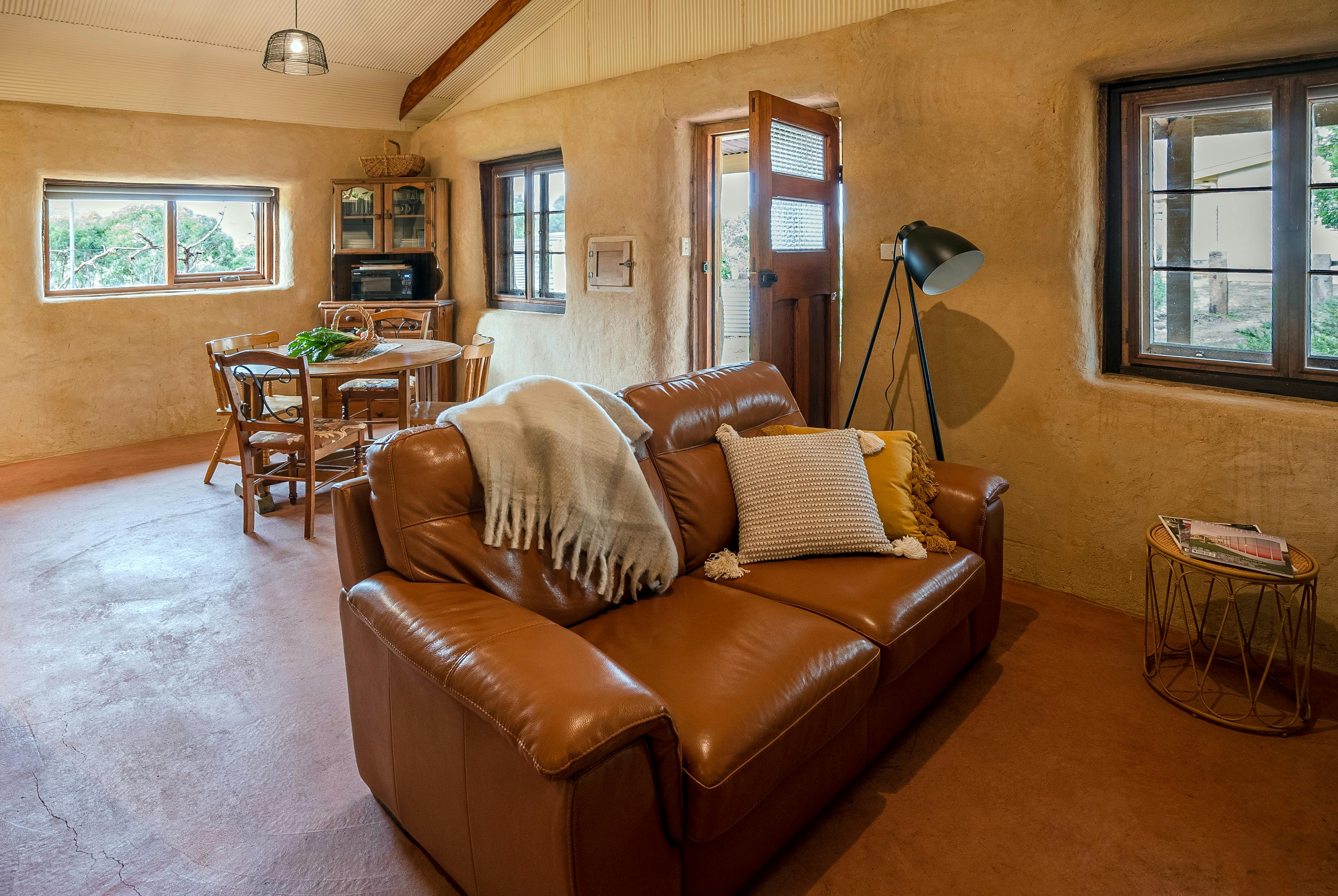 Leather lounge suite, perfect for snuggling up with a book, glass of wine, loved one.. you choose!