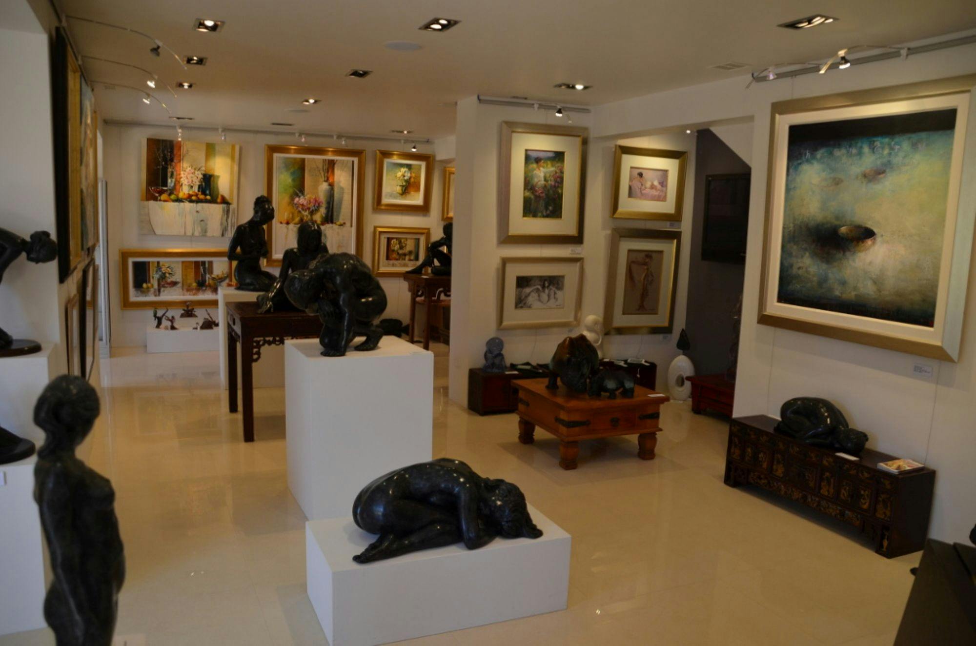 Image of the interior of Mackay Harrison Galleries featuring various artworks and sculptures