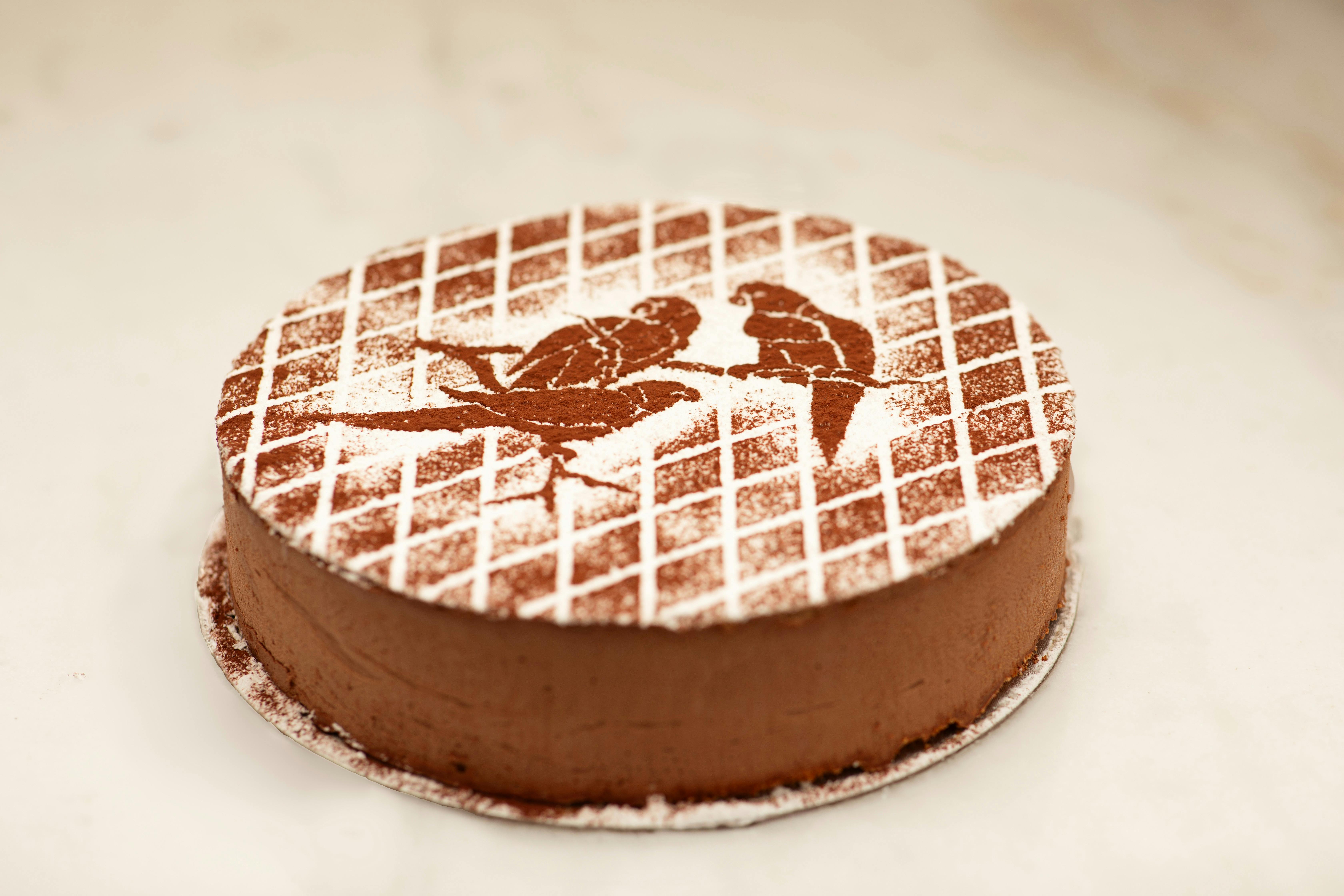 Two layers of almond and hazelnut  meringue, with a light, dark chocolate  mousse
