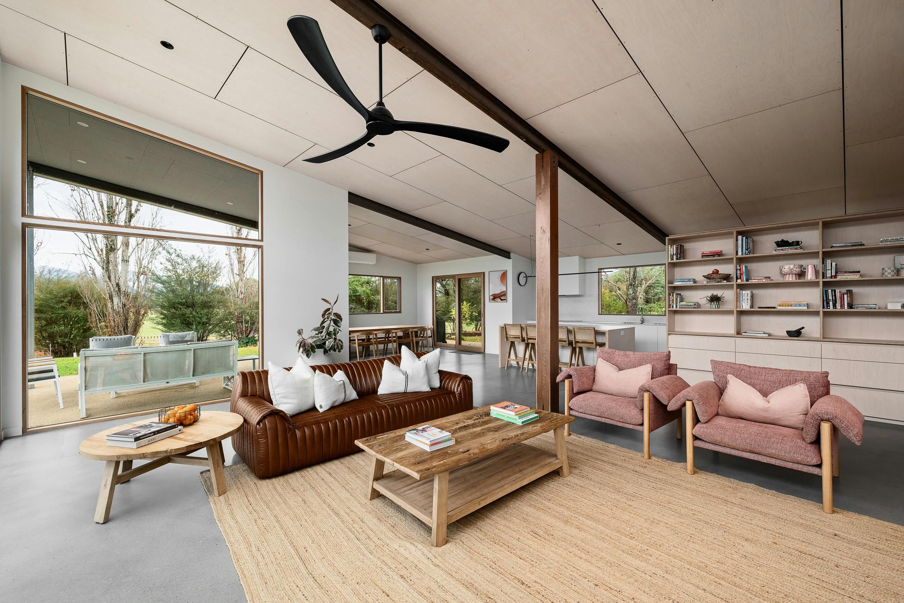 silver house,  living room area with couches, chairs, tea table and a ceiling fan