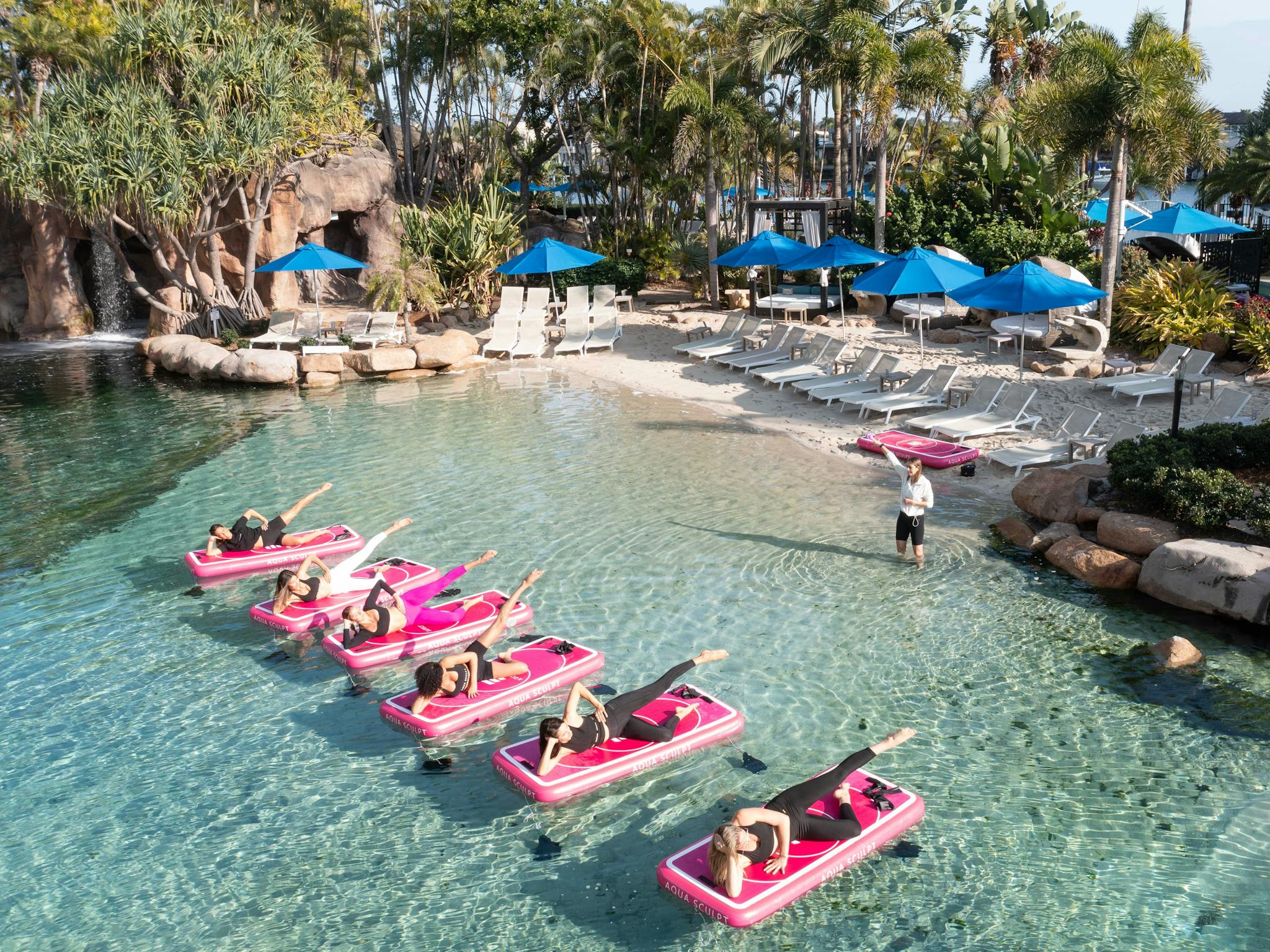 Group of women doing Aqua Sculpt Floating Pilates experience at JW Marriott Gold Coast Resort & Spa Group of women doing Aqua Sculpt Floating Pilates experience at JW Marriott Gold Coast Resort & Spa