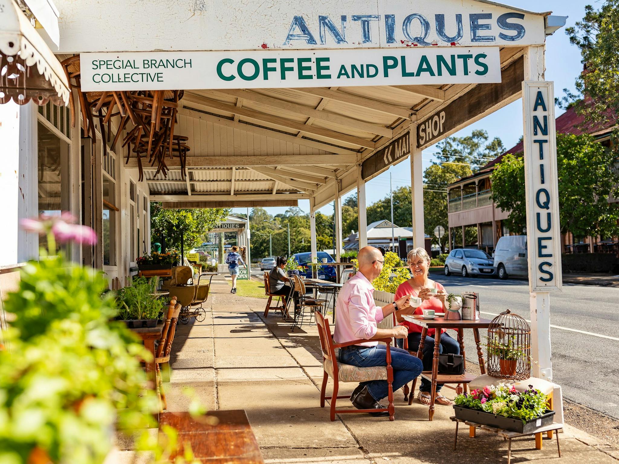 Couple sitting outside a cafe drinking tea Couple sitting outside a cafe drinking tea