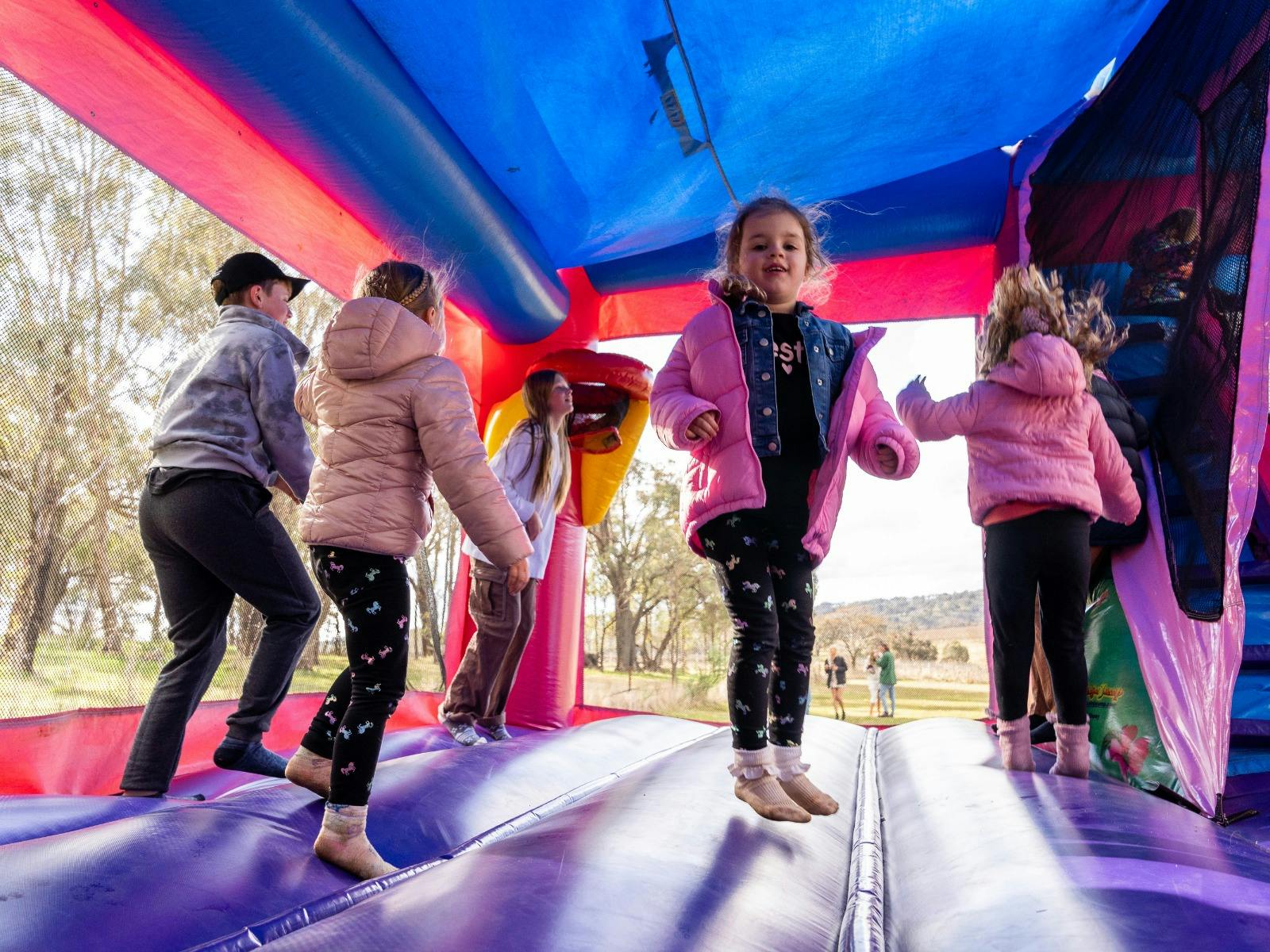 Kids enjoying a jumping castle at Stockmans Ridge Wines