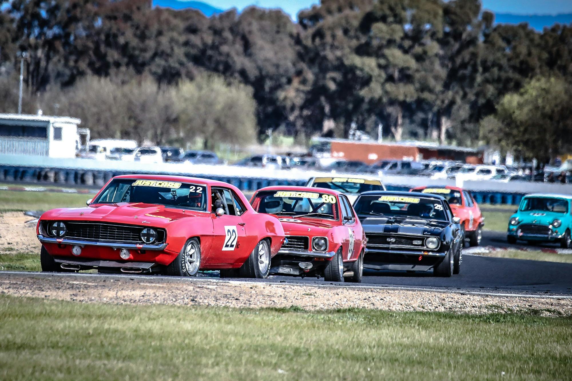 5 racing cars on track