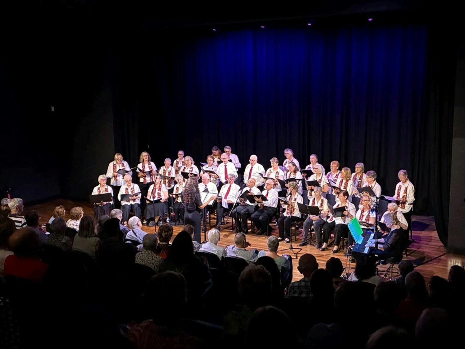 Sweet Tonic singers performing in the performance studio at CAC.