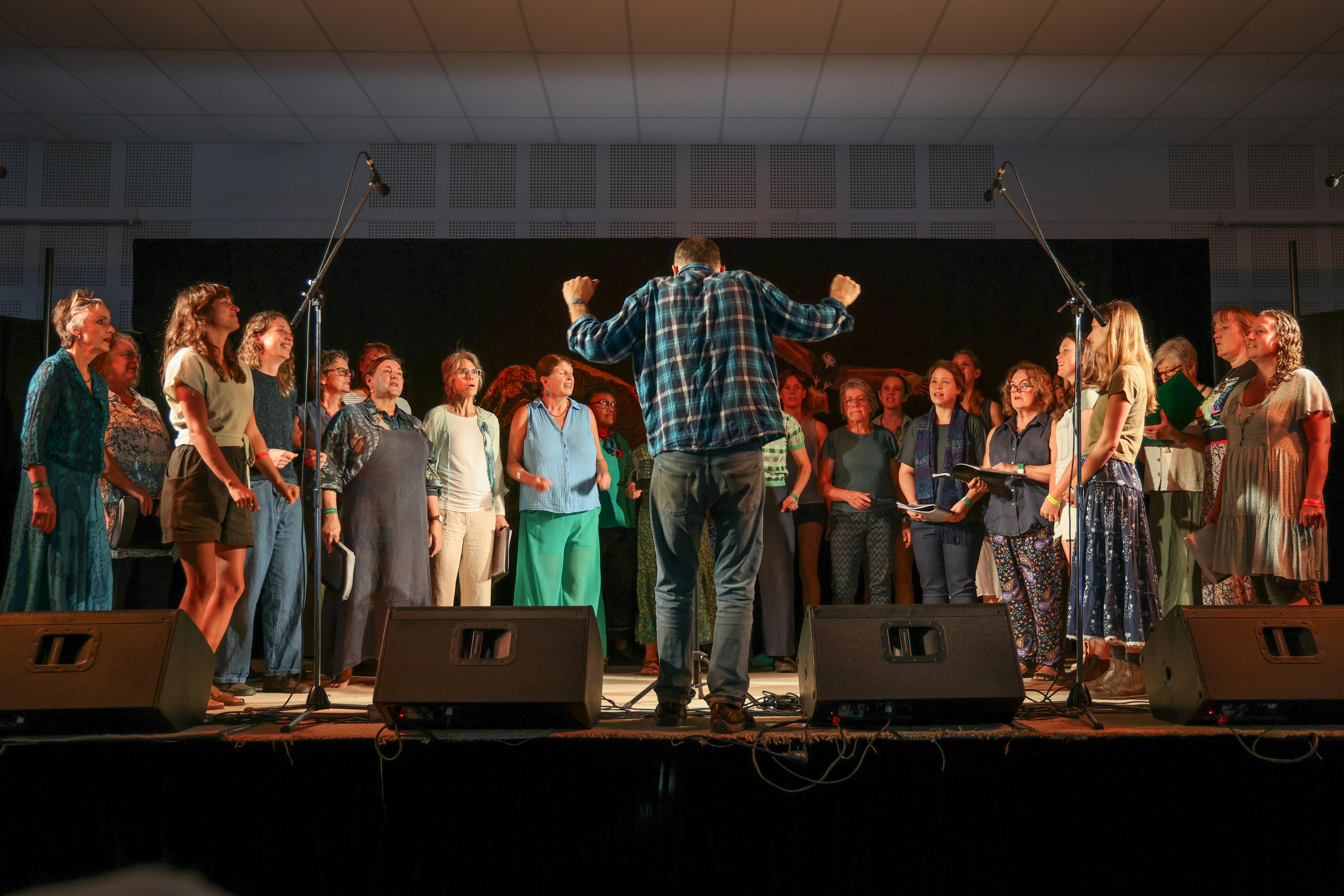 Members of the Riverbend Choir on stage at the Cobargo Folk Festival