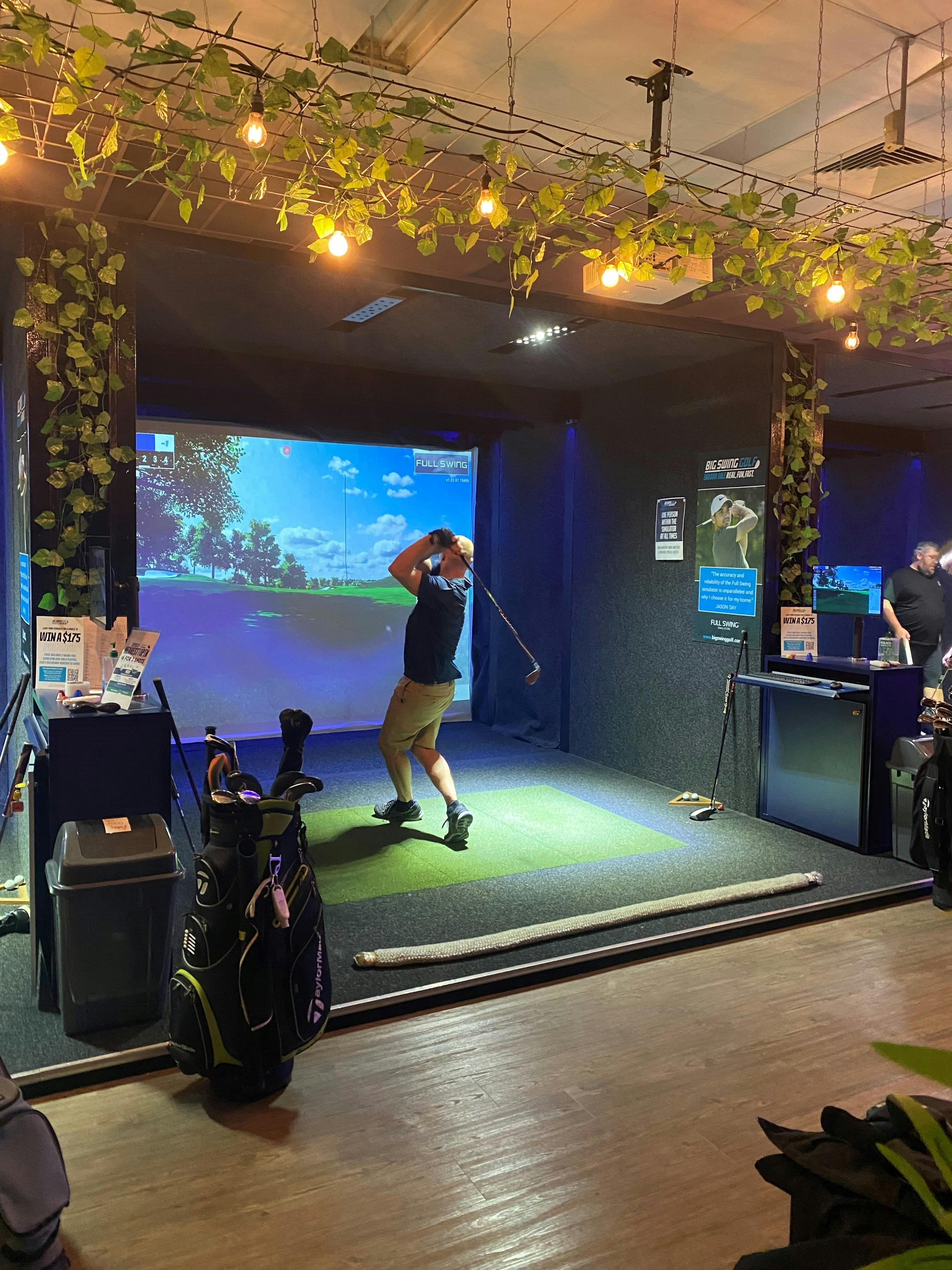 Golfer using the simulators