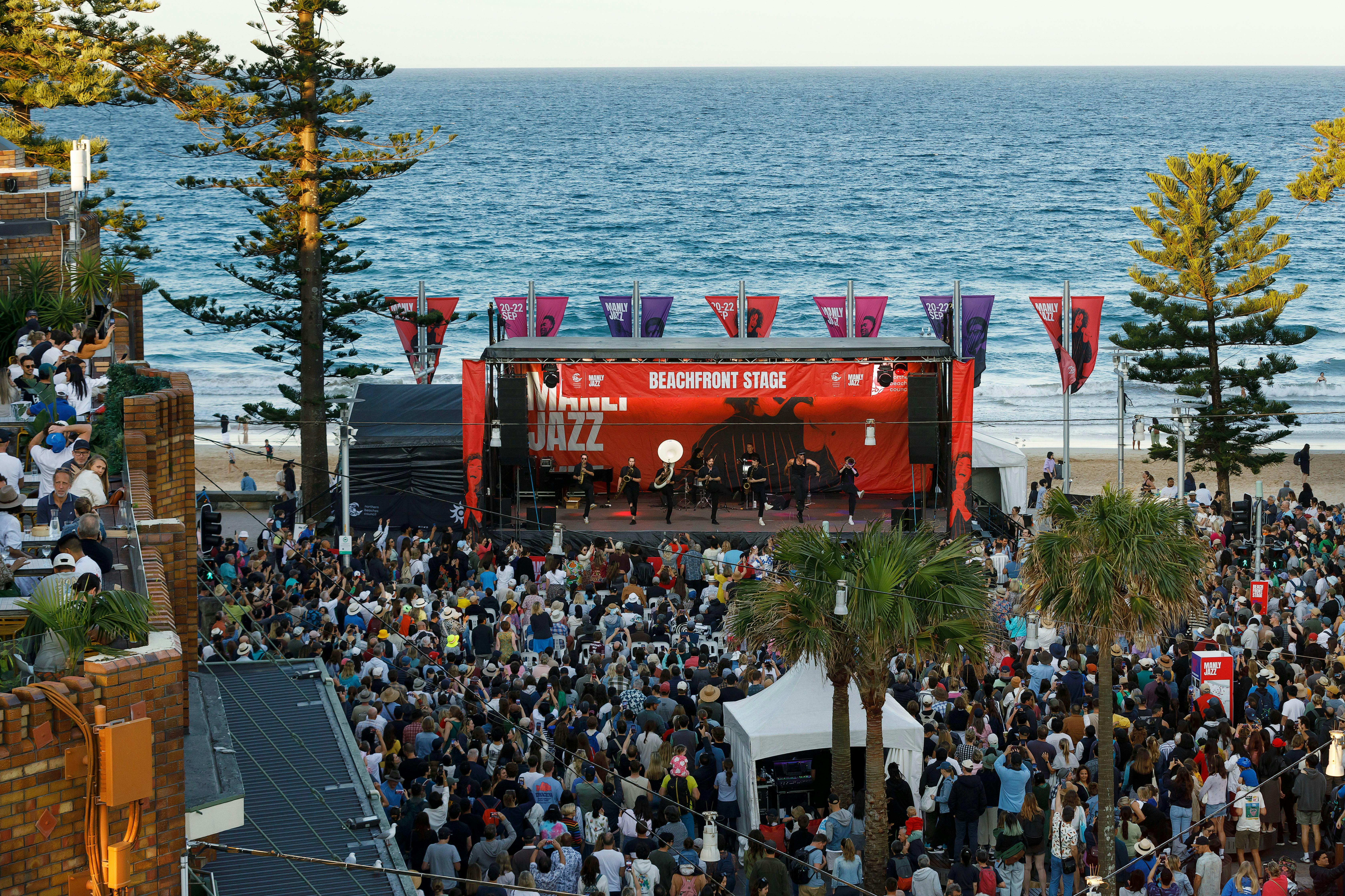 Aerial of beachfront stage at Manly Jazz with ocean behind stage