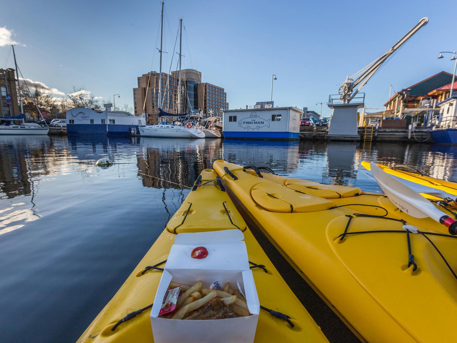 Fish and chips on a kayak situated on the Hobart waterfront
