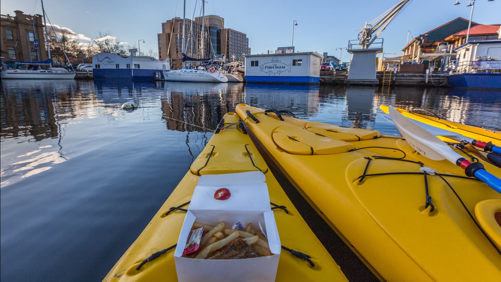 Fish and chips on a kayak situated on the Hobart waterfront