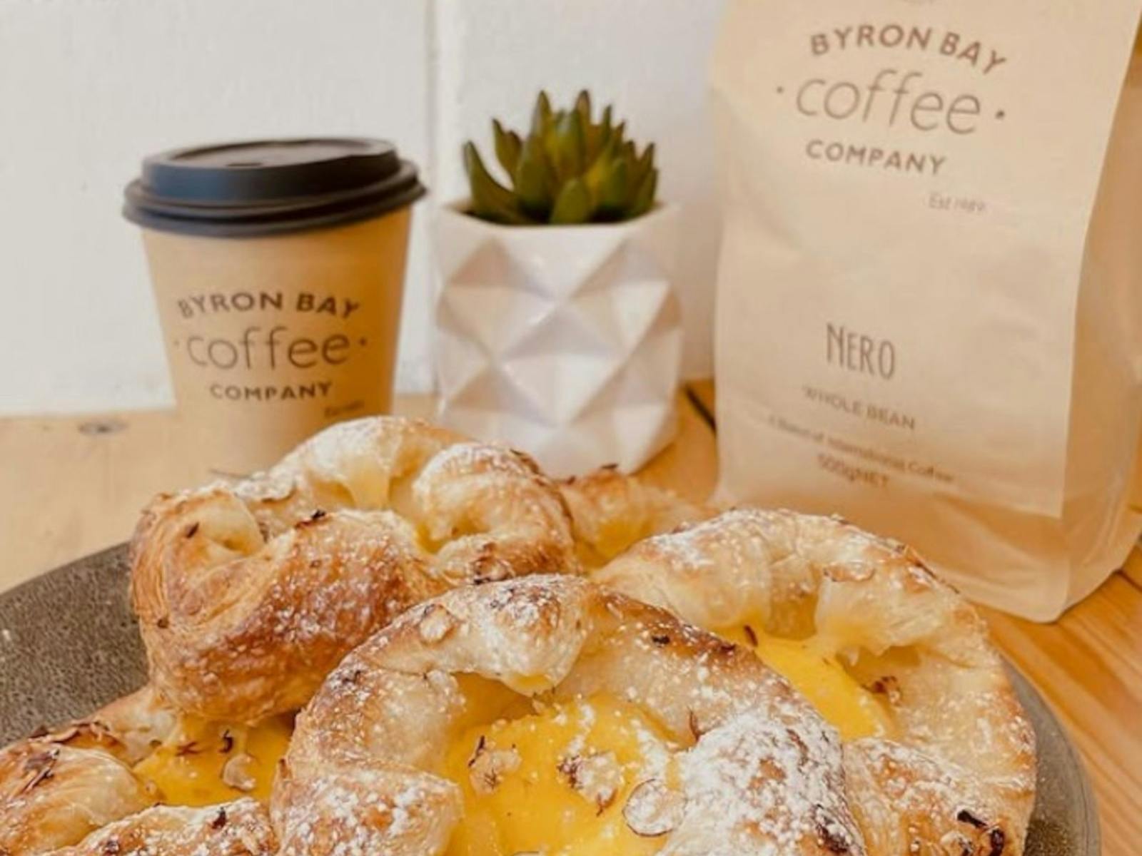 Custard tarts with coffee in the background