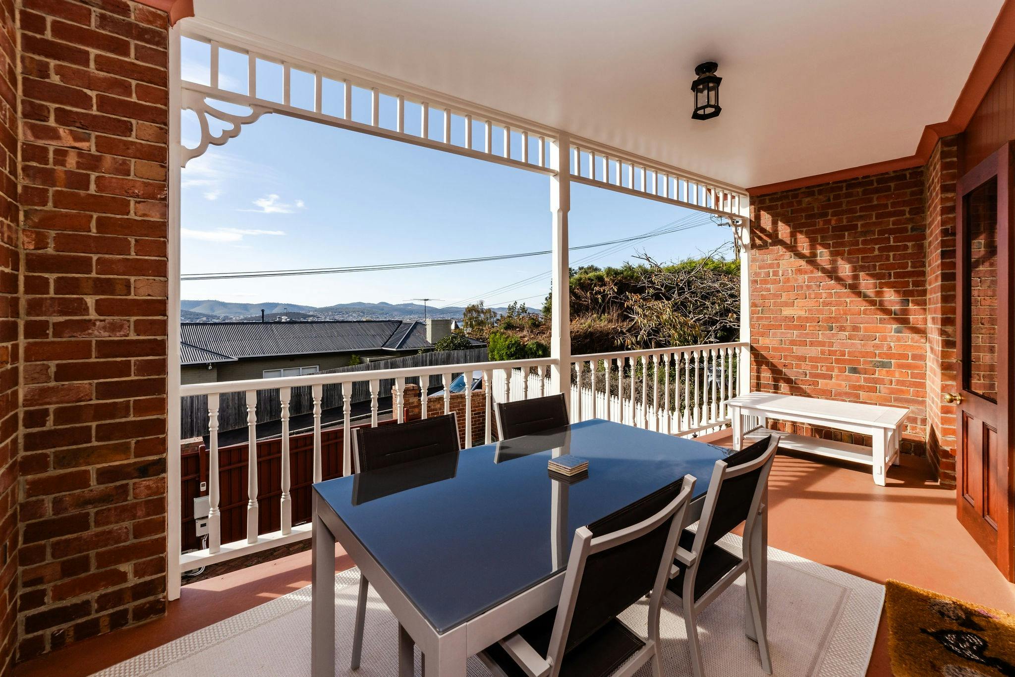View of Hobart City with glimpses of the sea from the deck and external seating for 4