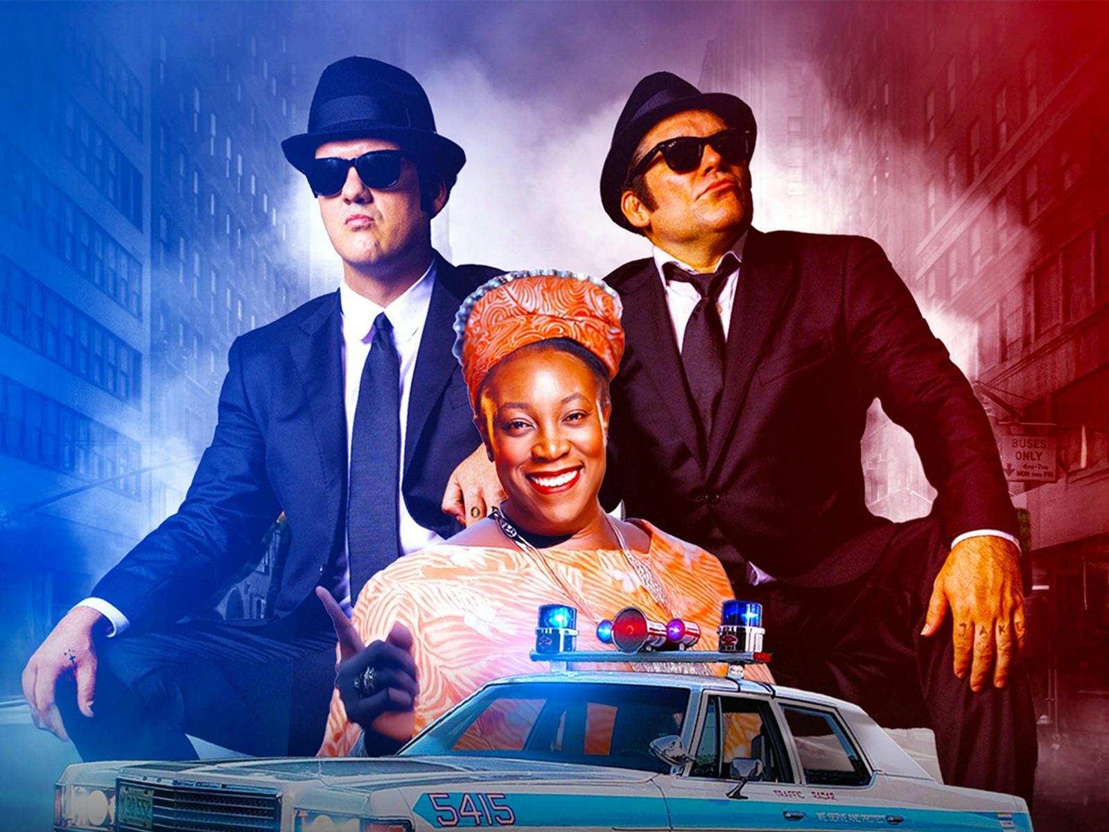 Two men dressed in matching suits, sunglasses and hats stand behind a woman in an orange dress Two men dressed in matching suits, sunglasses and hats stand behind a woman in an orange dress