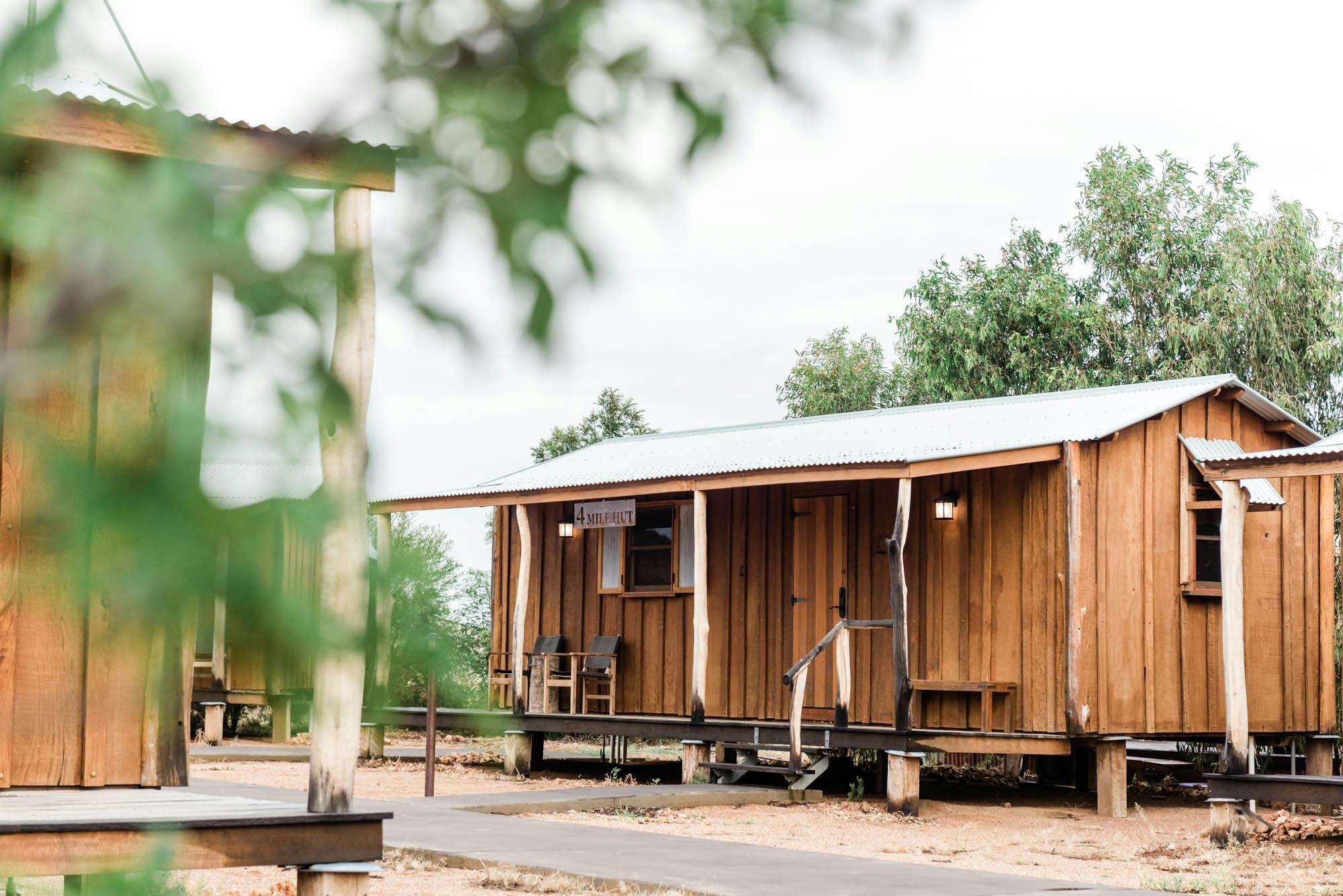 Rustic wooden cabin with tin roof