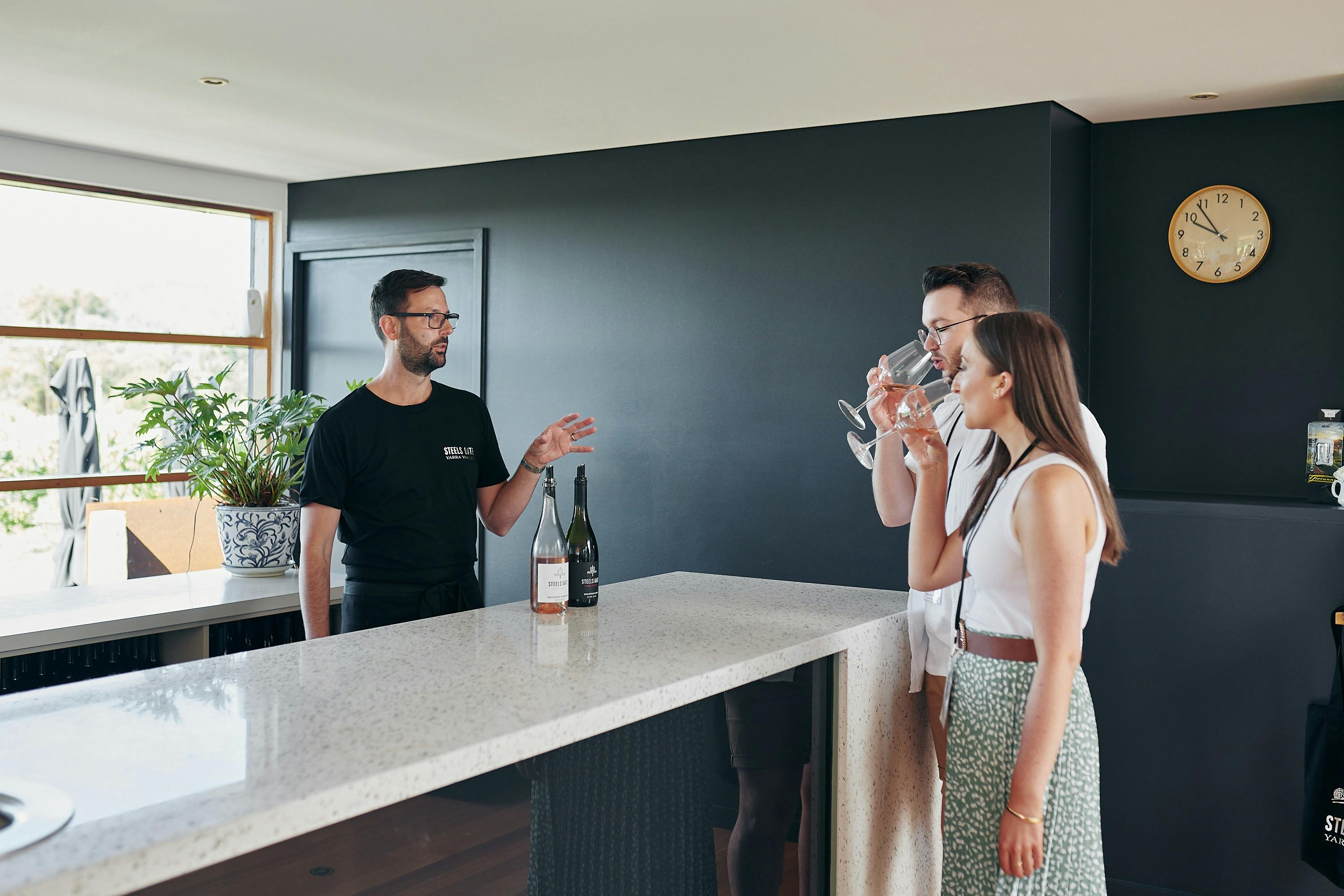 couple tasting wine at winery