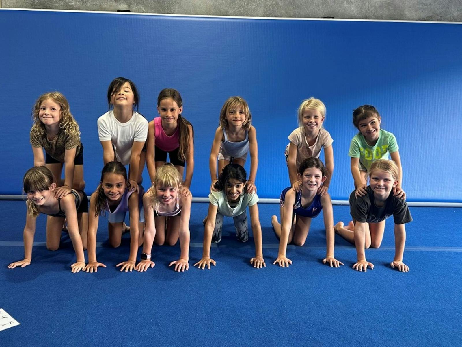 Children standing on on each others backs