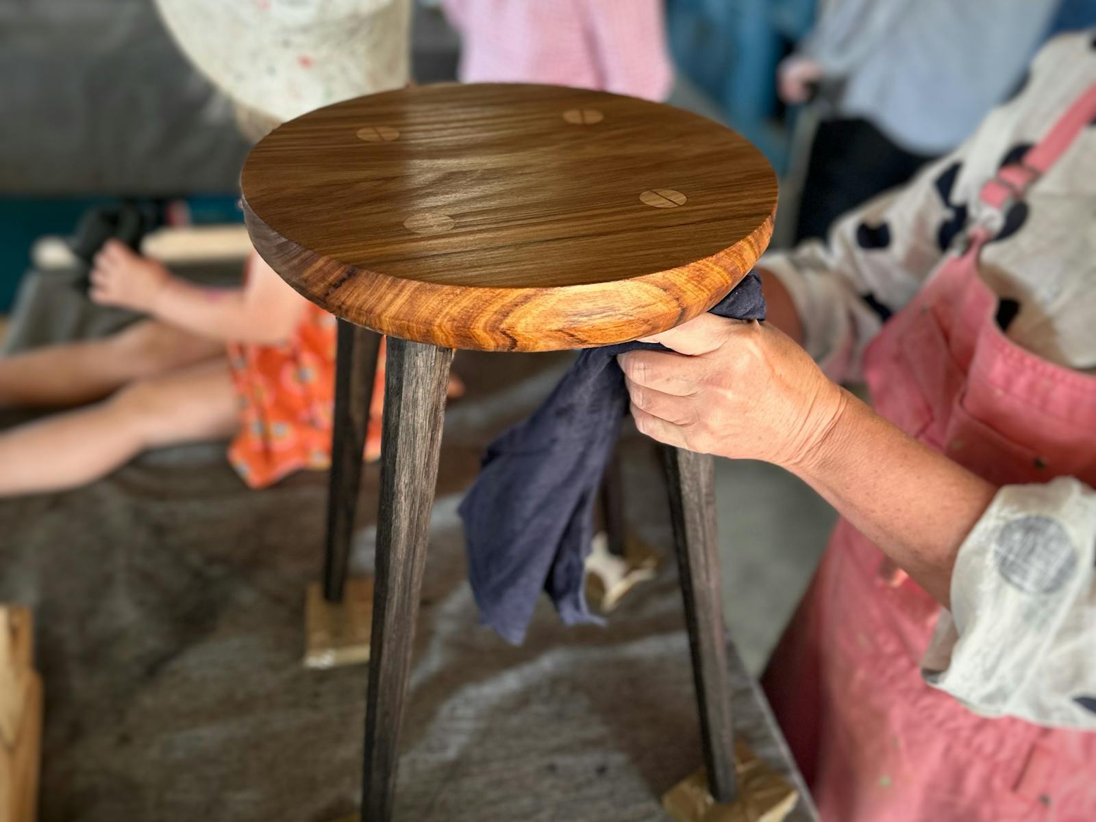 Elm stool with tapered faceted legs