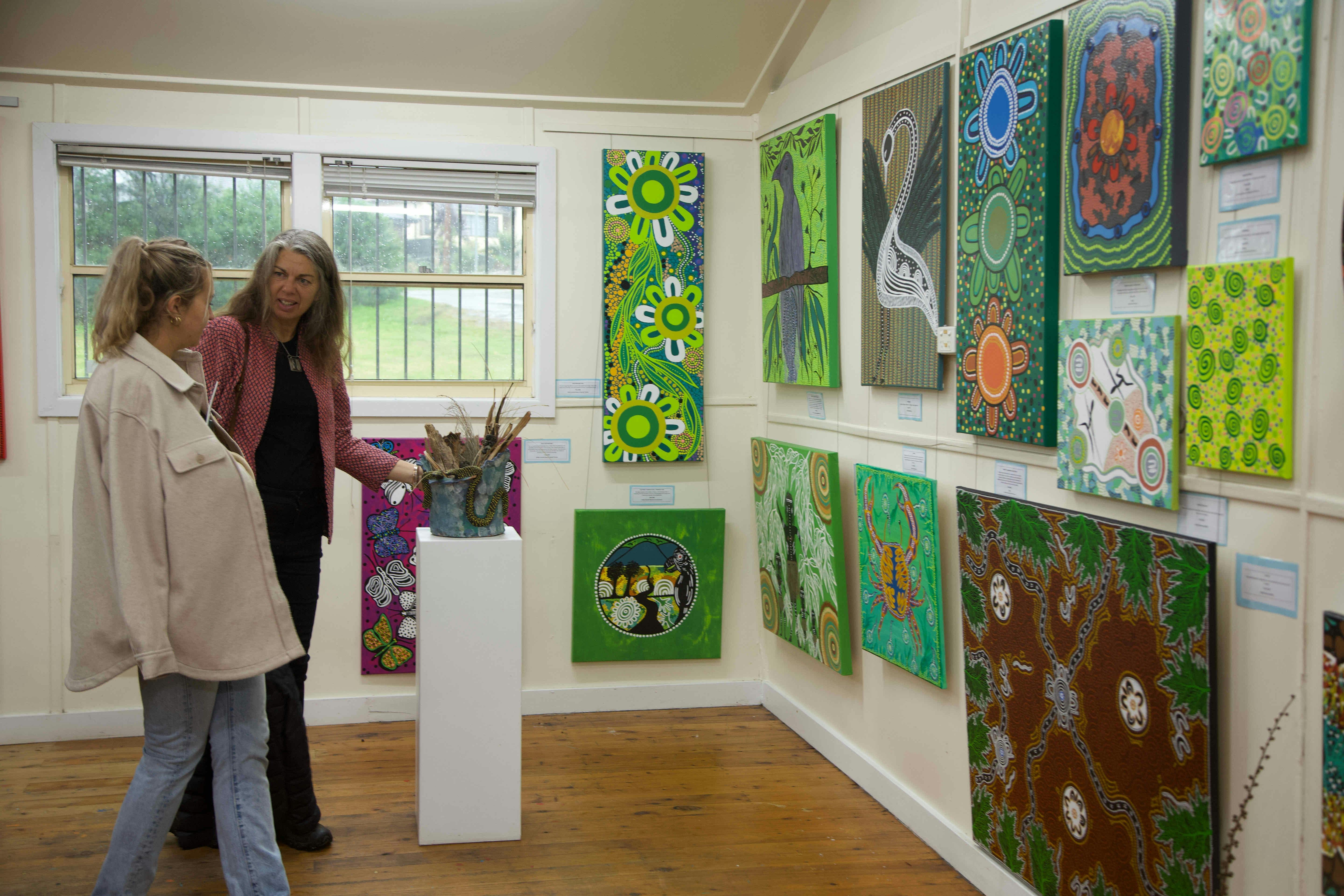 Last Minute Gallery Exhibition space with colourful paintings on the walls